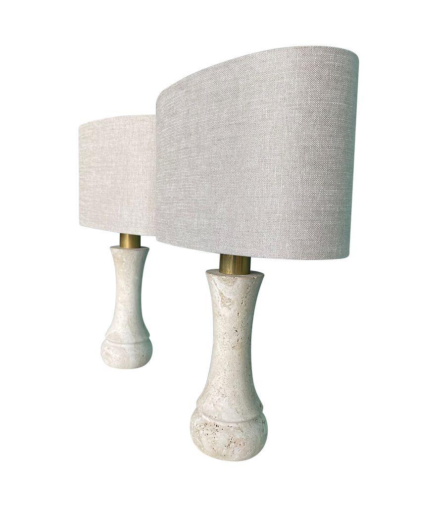 A pair of 1970s travertine lamps by Fratelli Mannelli with brass stems, re wired with new brass fittings, antique gold cord flex and switch. Available with new bespoke linen shades 
There are four pairs available - price is for a pair.