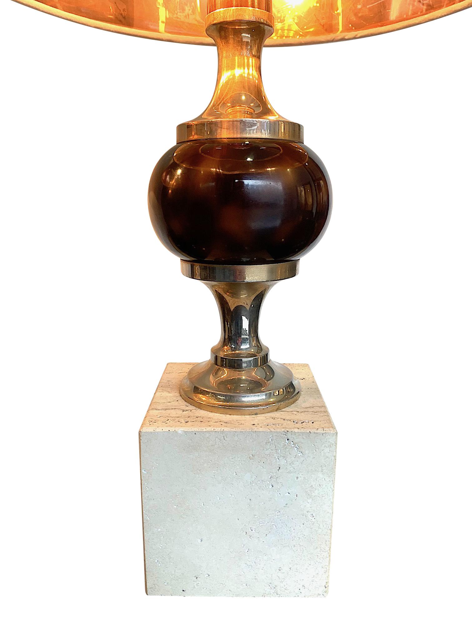 A pair of 1970s lamps with faux tortoiseshell sphere mounted on chrome support on a solid square travertine base in the style of Maison Barbier. Re wired with new fittings and antique cord flex and PAT tested, with new textured shades with gold