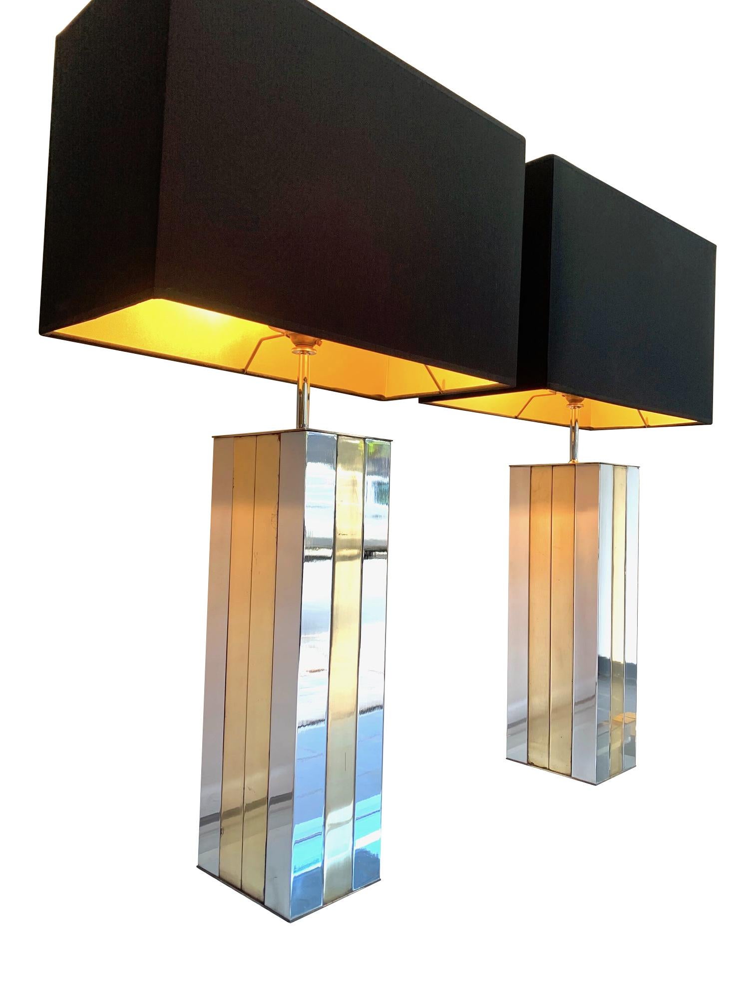 A pair of large 1970s Willy Rizzo brass and chrome lamps with single fitting with new bespoke black shades with gold linings. Re wired with new fittings, antique gold cord flex and PAT tested.