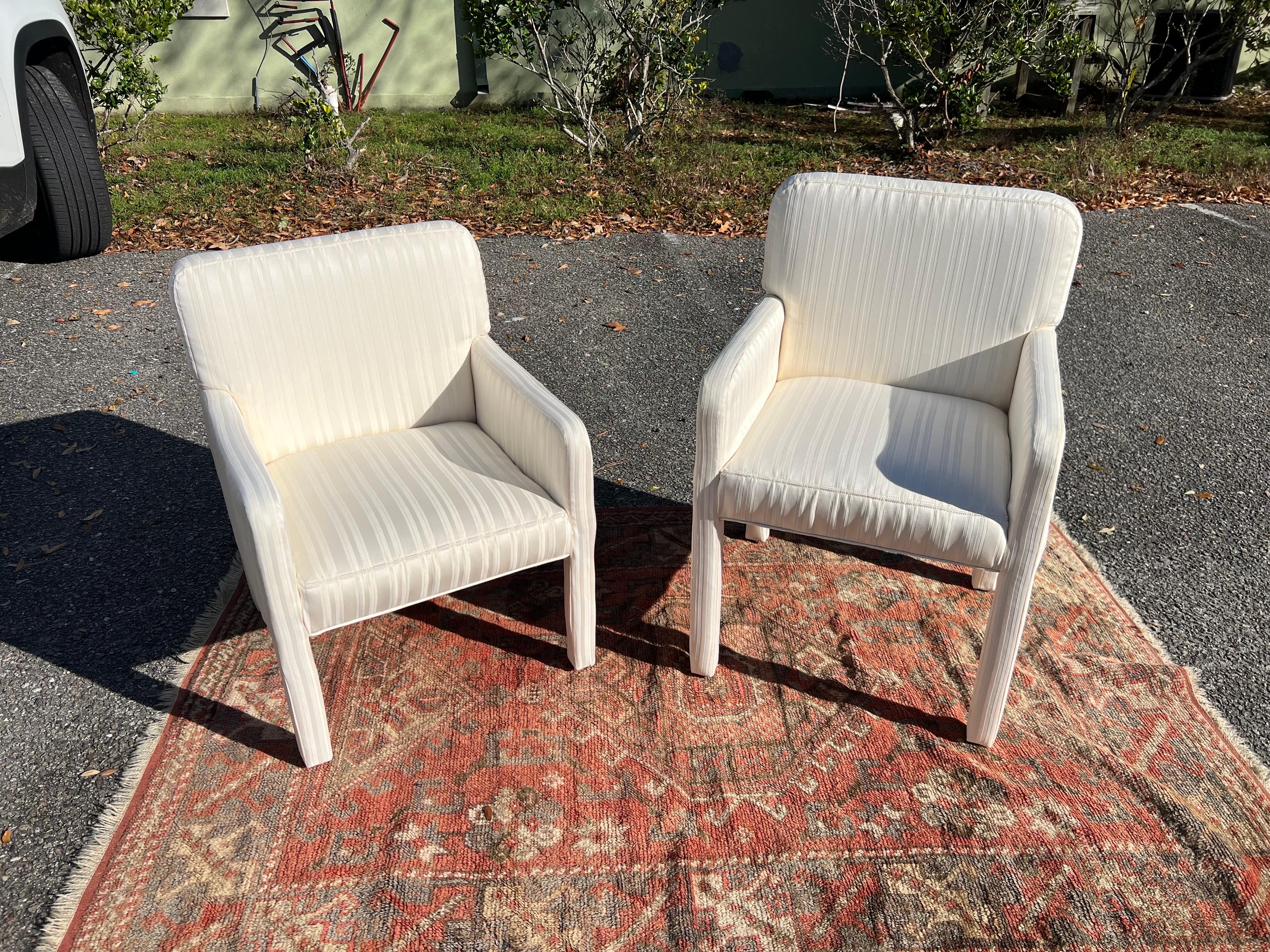 A fabulous set of fully upholstered arm chairs. 
VLADIMIR KAGAN DESIGNED A NUMBER OF PIECES FOR THE FURNITURE COMPANY DIRECTIONAL, ALTHOUGH WE COULDN'T FIND MORE INFORMATION IF HE DESIGNED THESE OR NOT. THESE COULD VERY WELL BE A SET OF ONE-OFF