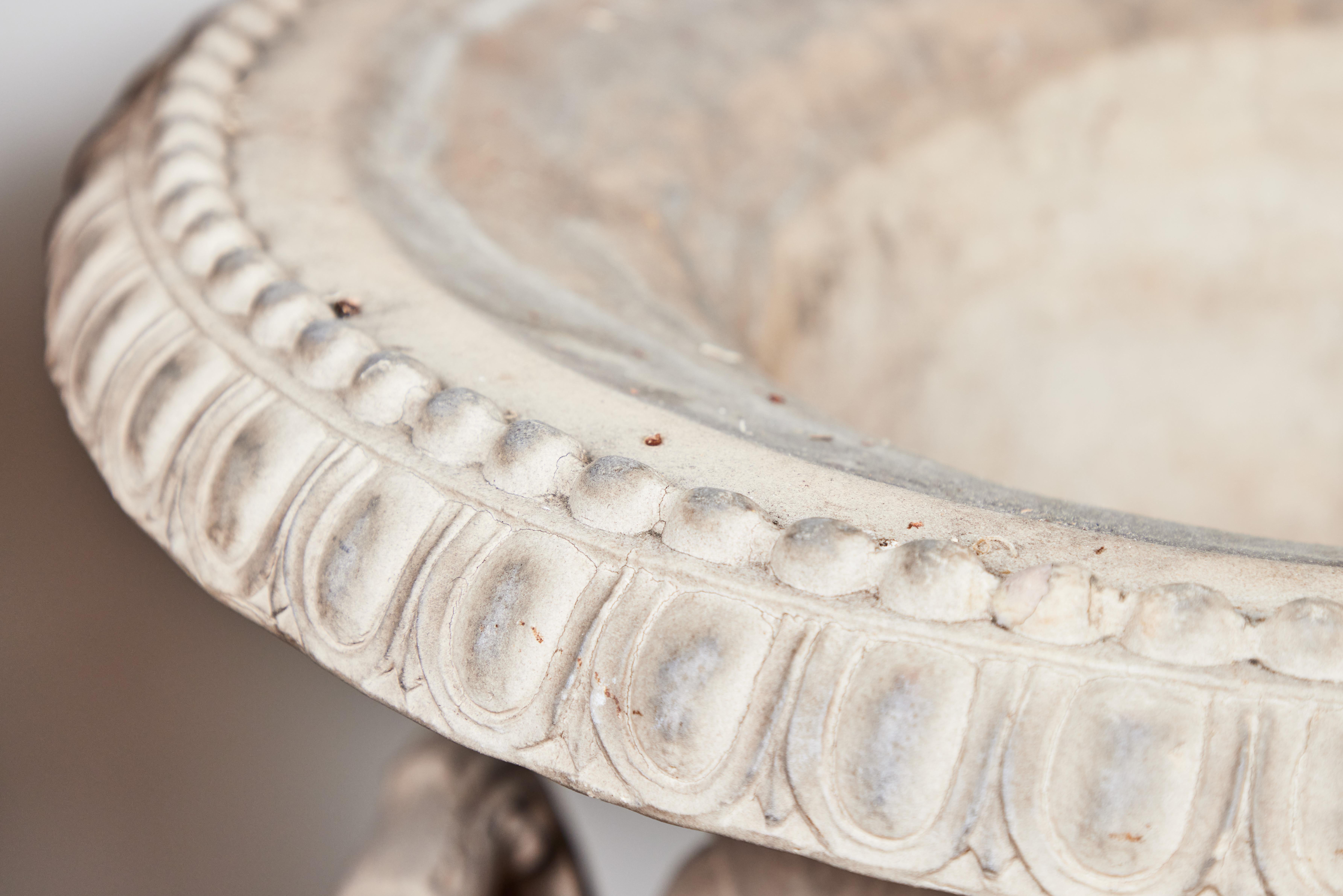 Grand pair of late 19th century, terracotta urns featuring reliefs of Neptune / Poseidon amidst the waves flanked by a hippocampus and a sea serpent. Stamped “Galloway Pottery, Philadelphia”, a company that specialized in making direct copies of