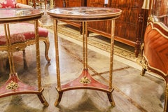 A  pair of  19th c Continental mahogany and gilt bronze mounted gueridon tables