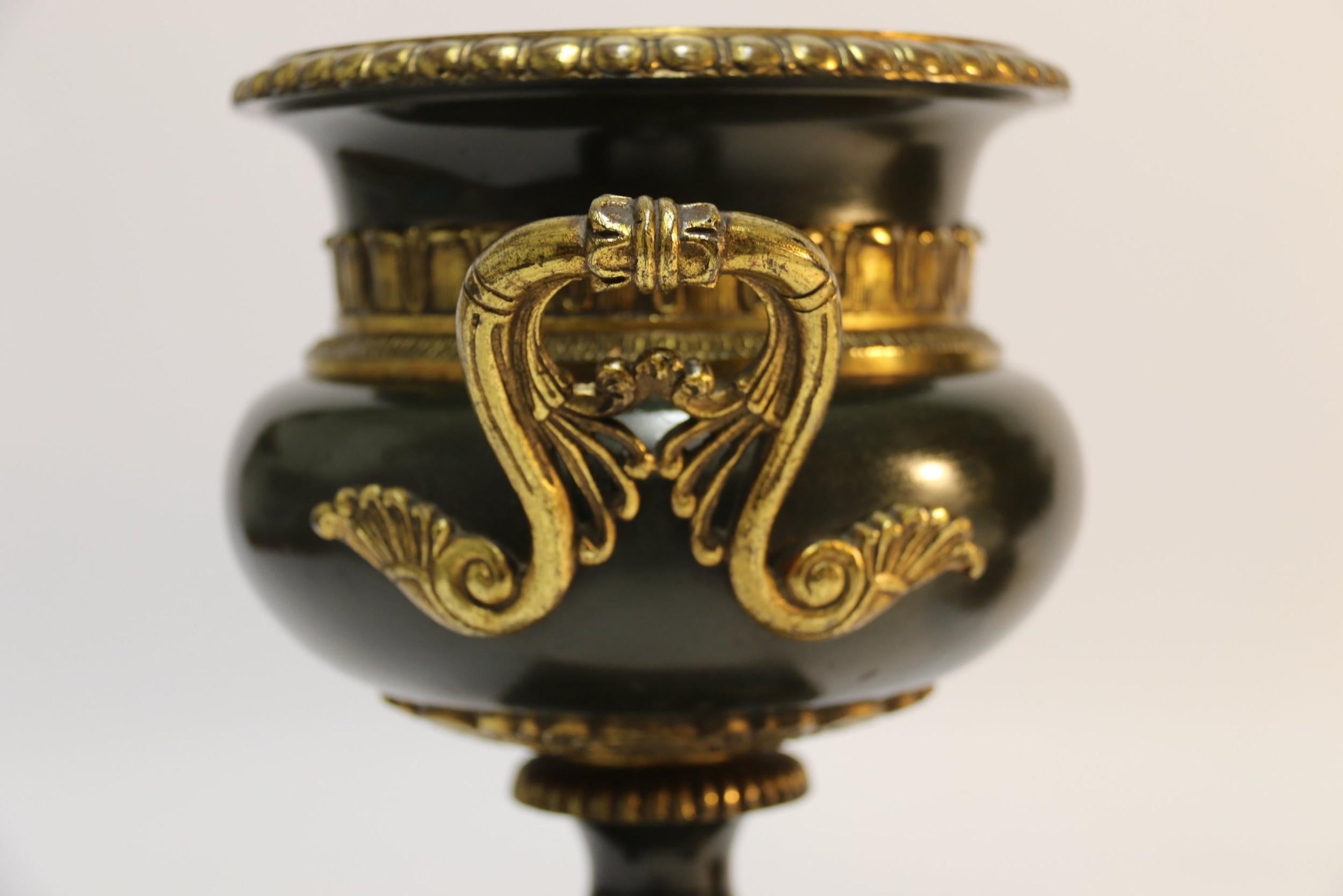Late 19th Century Pair of 19th Century French Bronze and Gilt Urns with Marble Bases For Sale