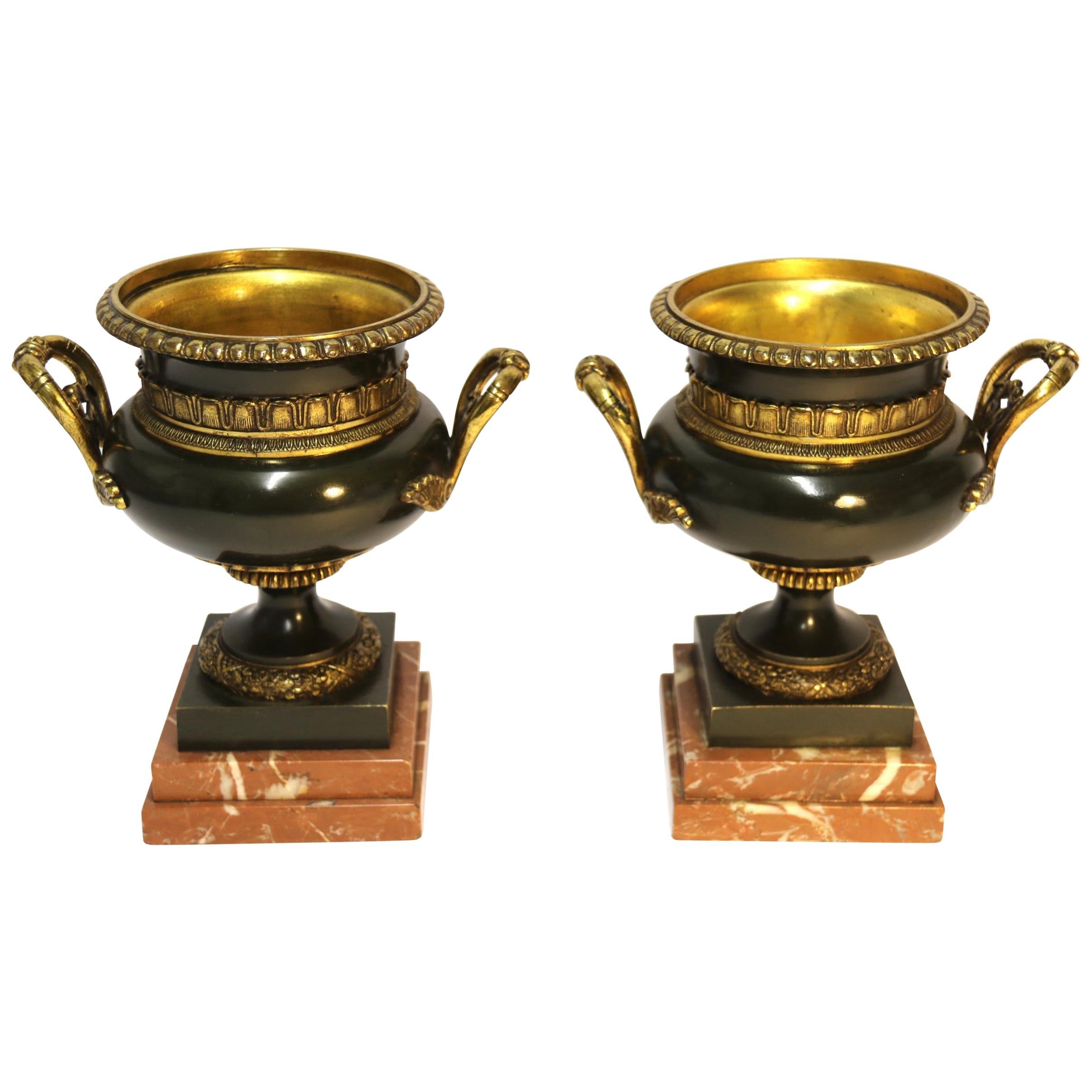 Pair of 19th Century French Bronze and Gilt Urns with Marble Bases For Sale