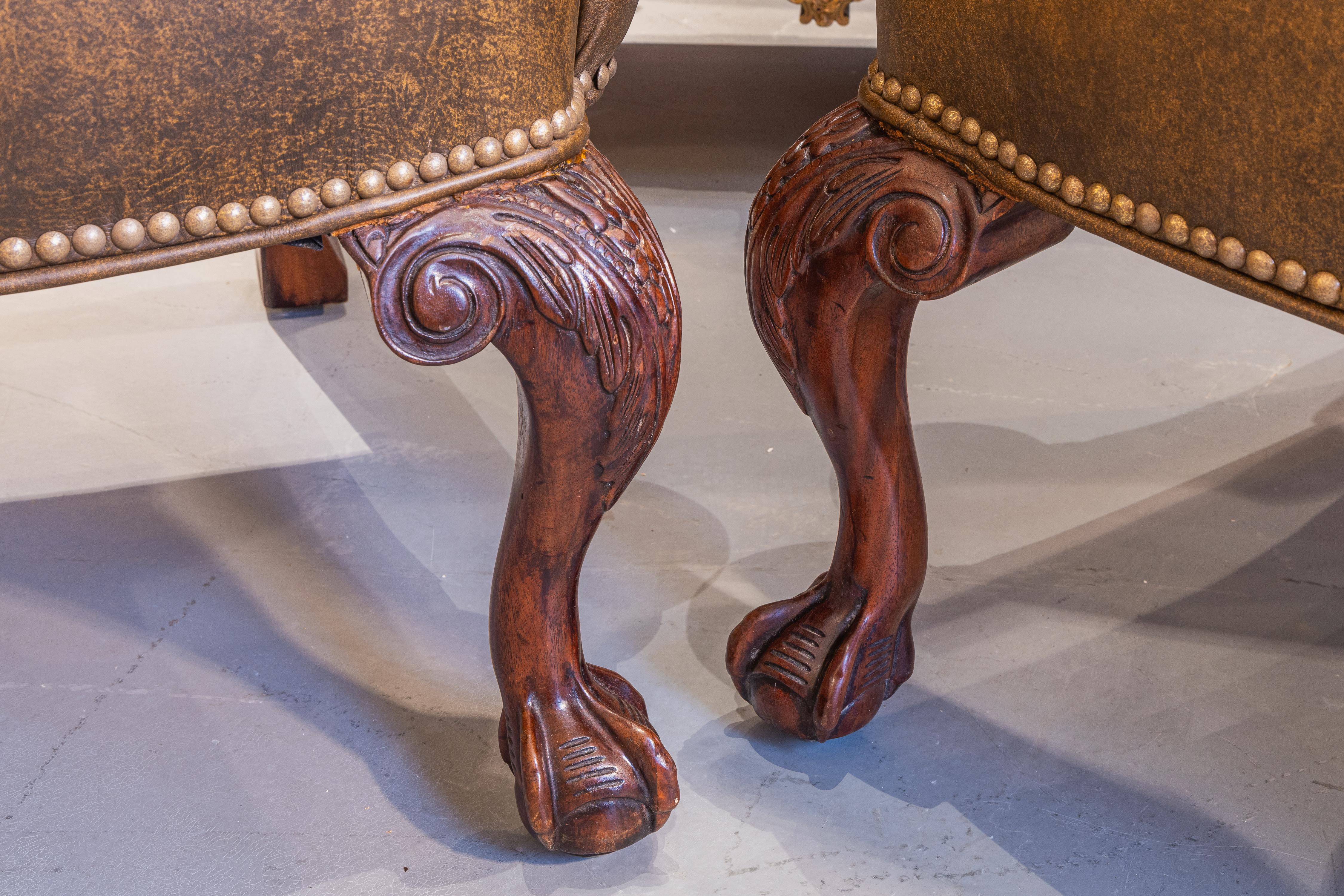 Hand-Carved A  pair of 19th c George 1 style mahogany English wingchairs . Ball and claw  For Sale