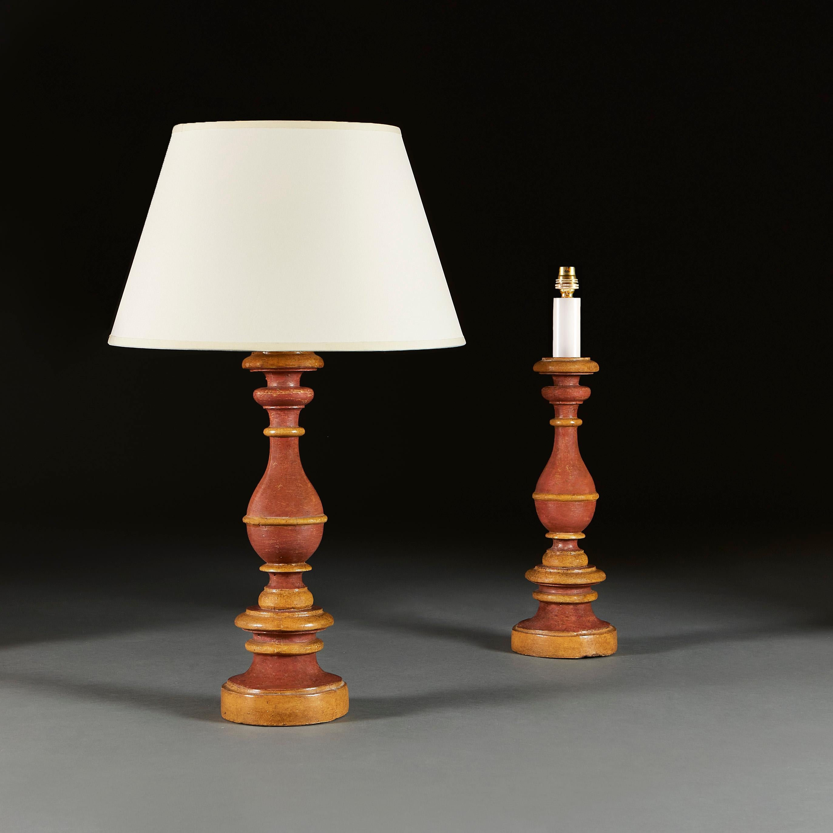 Italy, circa 1900

A good pair of turned baluster candlesticks painted in subtle tones of amber and coral, supported on cylindrical bases, now converted as lamps.

Height of candlestick 42.00cm
Height with lampshade 67.00cm
Diameter of base