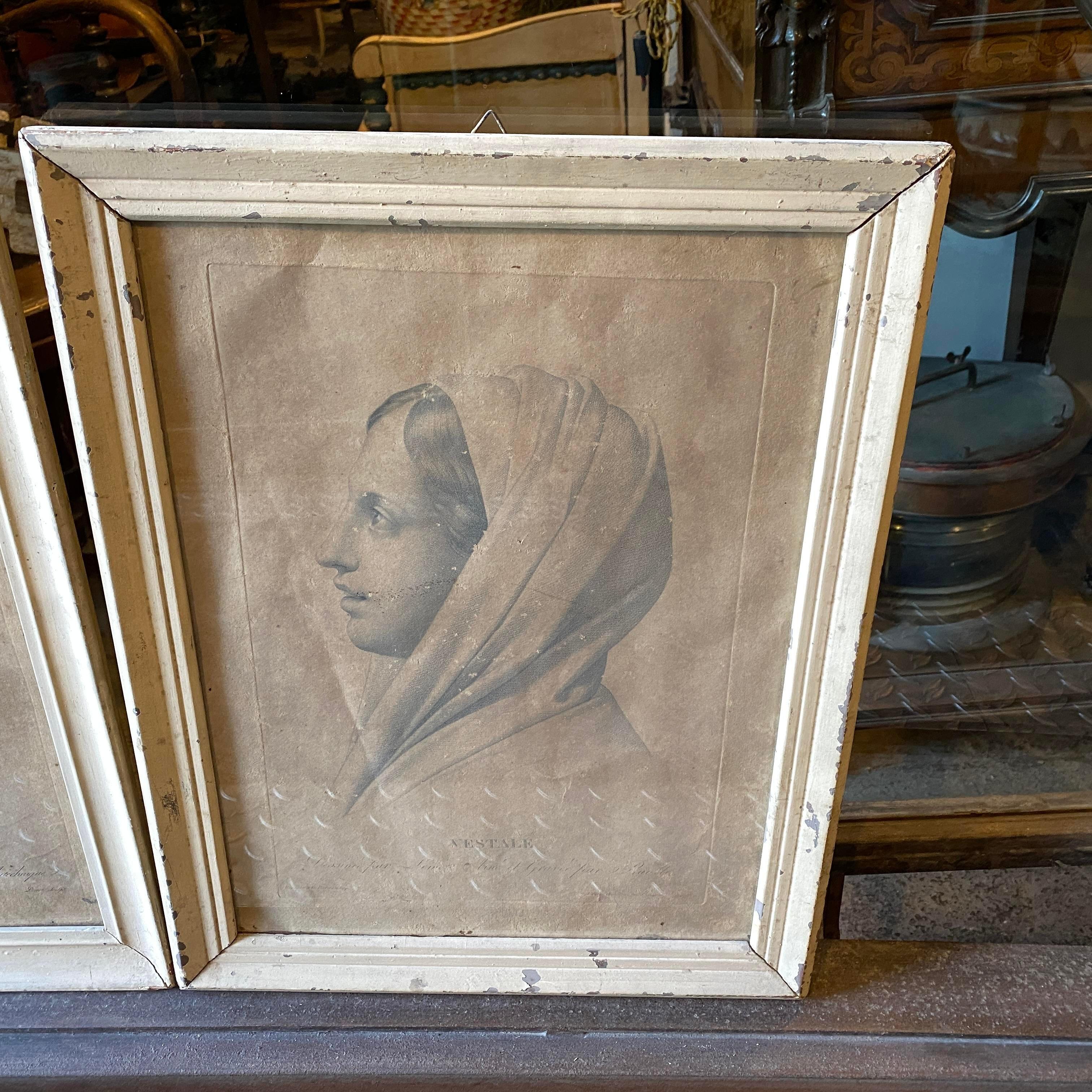 A pair of antique prints depicting two young girls, original white painted wood frame. Real signs of use and age.