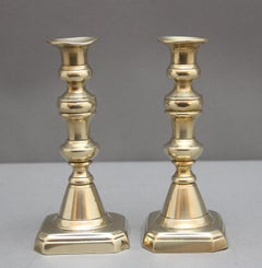 A pair of 19th Century brass candlesticks