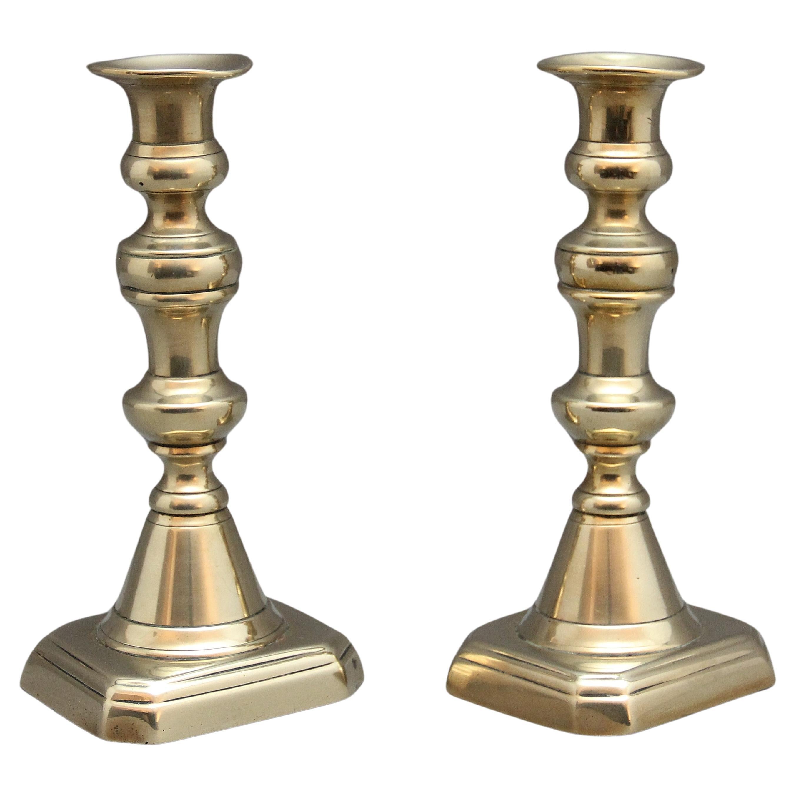 A pair of 19th Century brass candlesticks