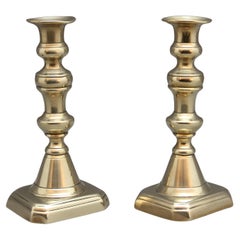 A pair of 19th Century brass candlesticks