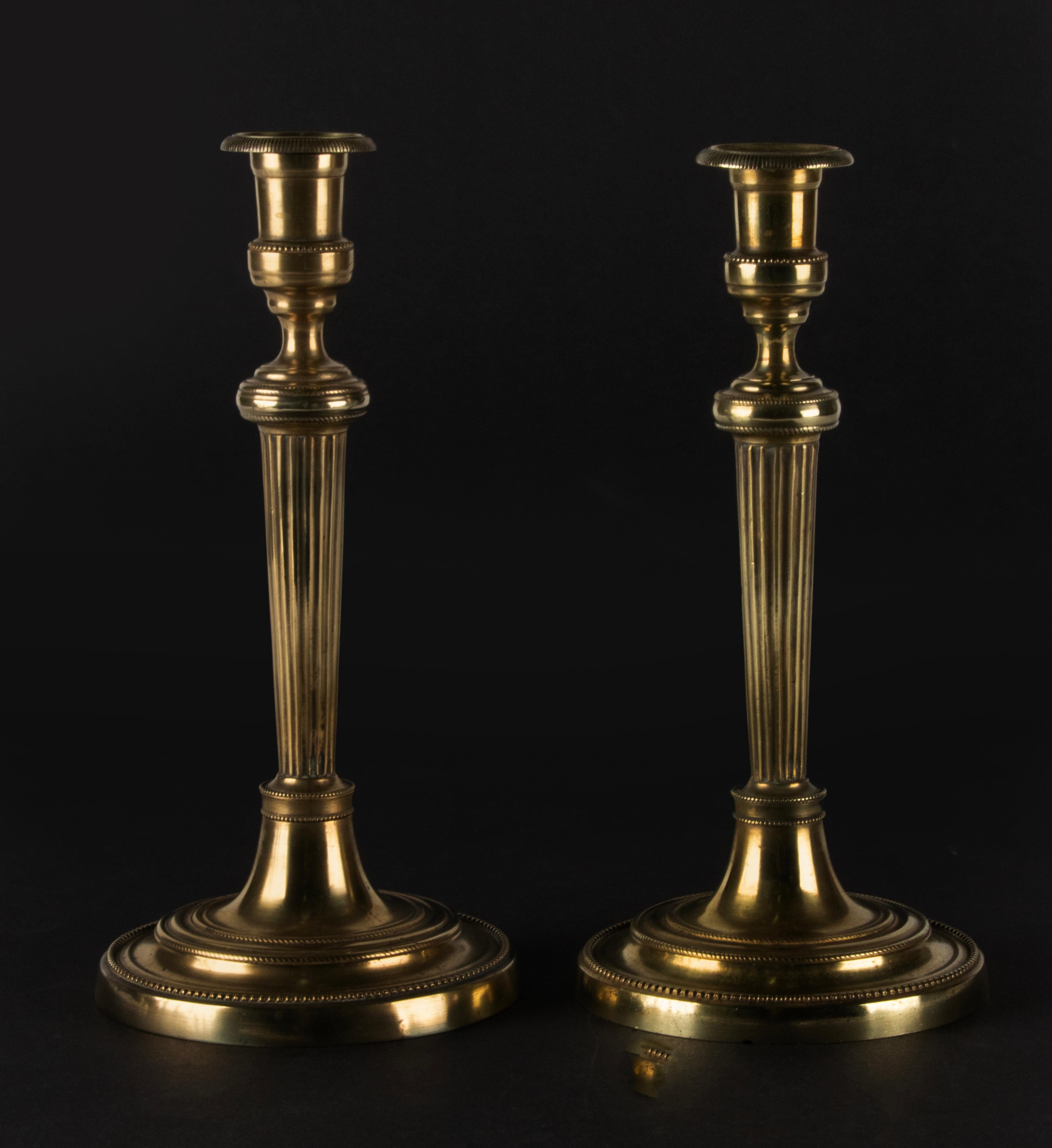 French A Pair of 19th Century Brass Louis XVI Style Candlesticks For Sale