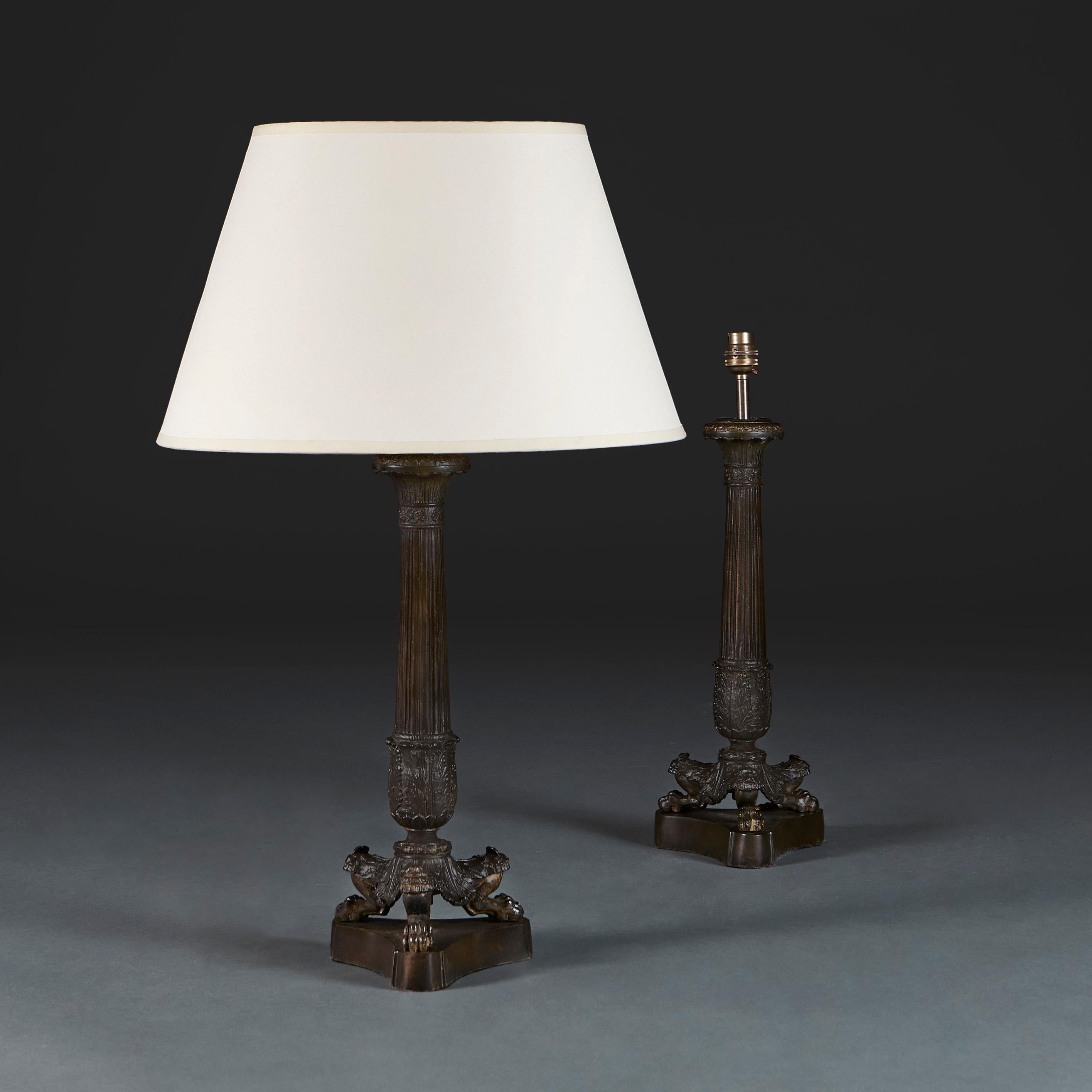 England, circa 1890

A pair of late nineteenth century bronze column lamps, with fluted uprights supported on tripod plinth base, with hairy paw feet.

Height of column 41.00cm
Height with shade 66.00cm
Width of base 16.00cm.

Please note: This is