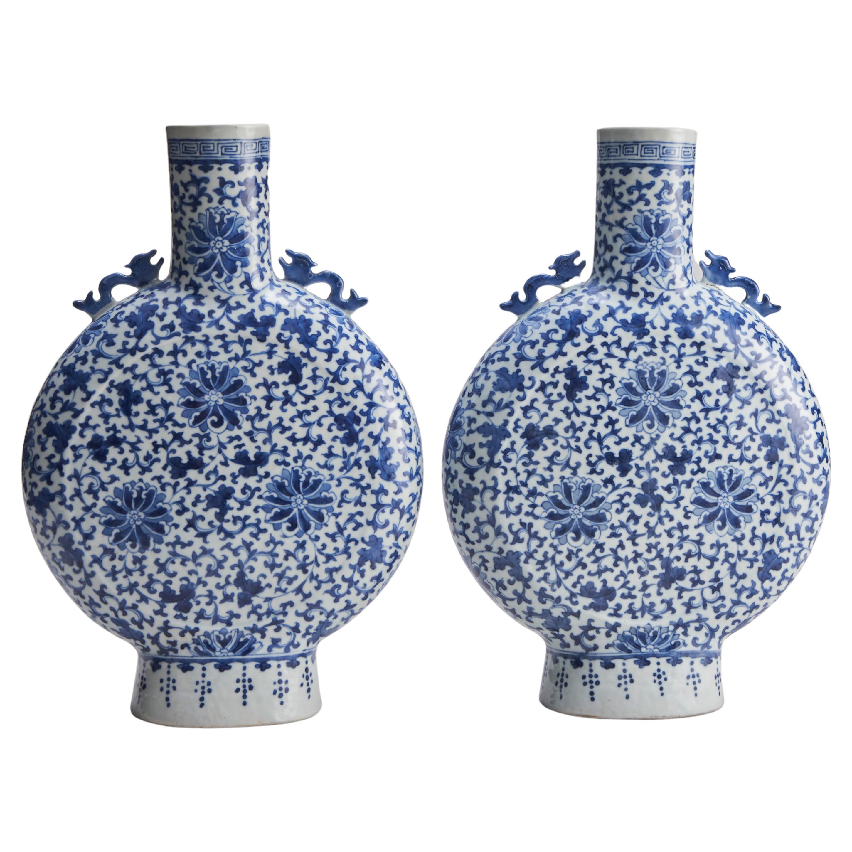 A pair of 19th Century, Chinese porcelain blue and white pilgrim vases