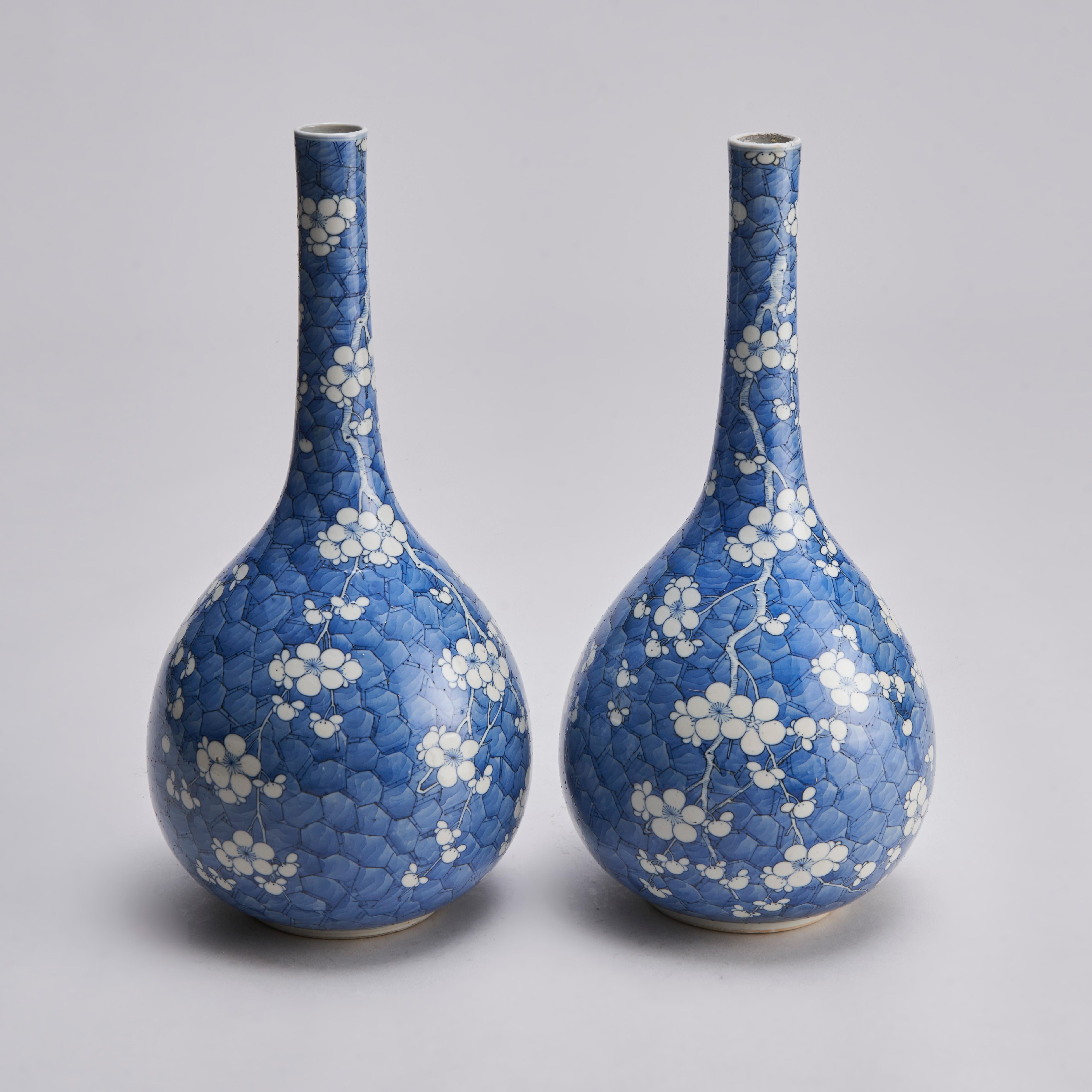 From our collection of antique Chinese porcelain, this pair of 19th century blue and white bottle vases (46cm in height) with very fine tapered necks and fine decoration of plum blossom on a cracked ice ground.

Contact us for further information,