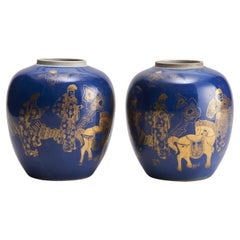 A pair of 19th Century Chinese powder blue jars with gold decoration depic