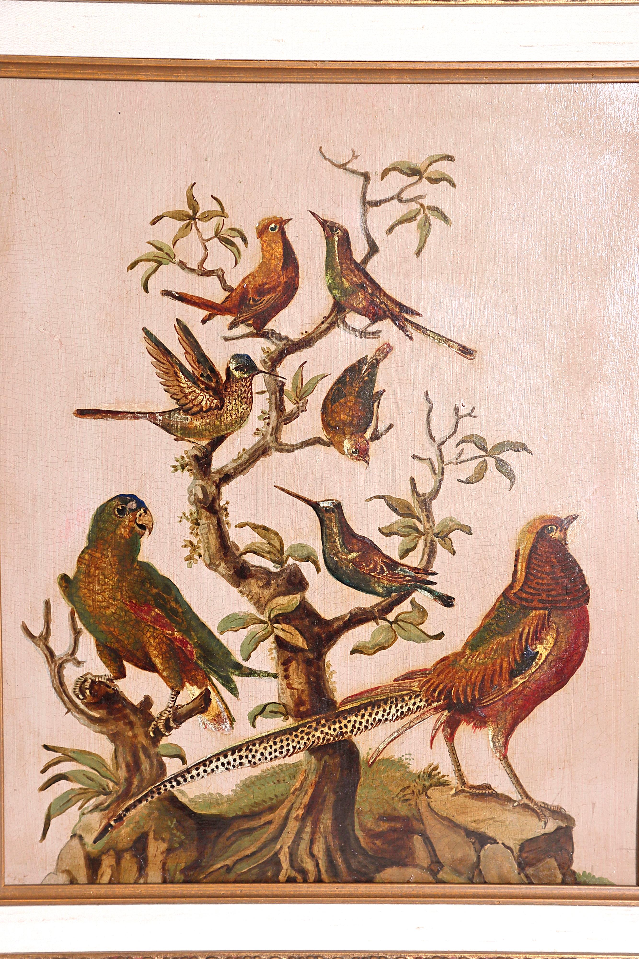 Pair of oil paintings with realistically painted birds on sculptural trees in natural coloration, six (6) birds in one, seven (7) birds in the other, a lizard steals eggs from a nest at the base of one of the trees, both in elaborate frames 

21