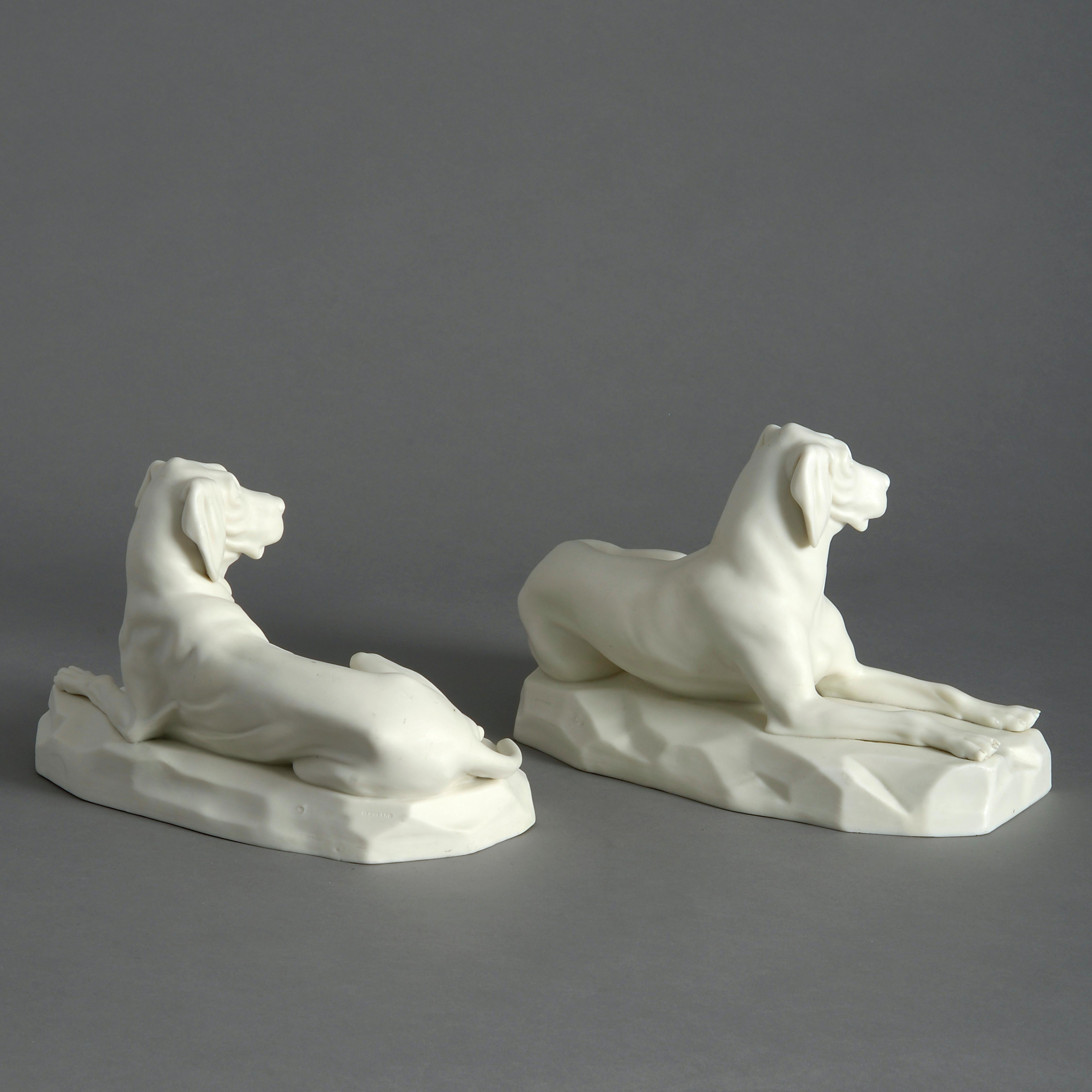A pair of mid-19th century finely modelled Copeland parian hounds, each depicted recumbent.