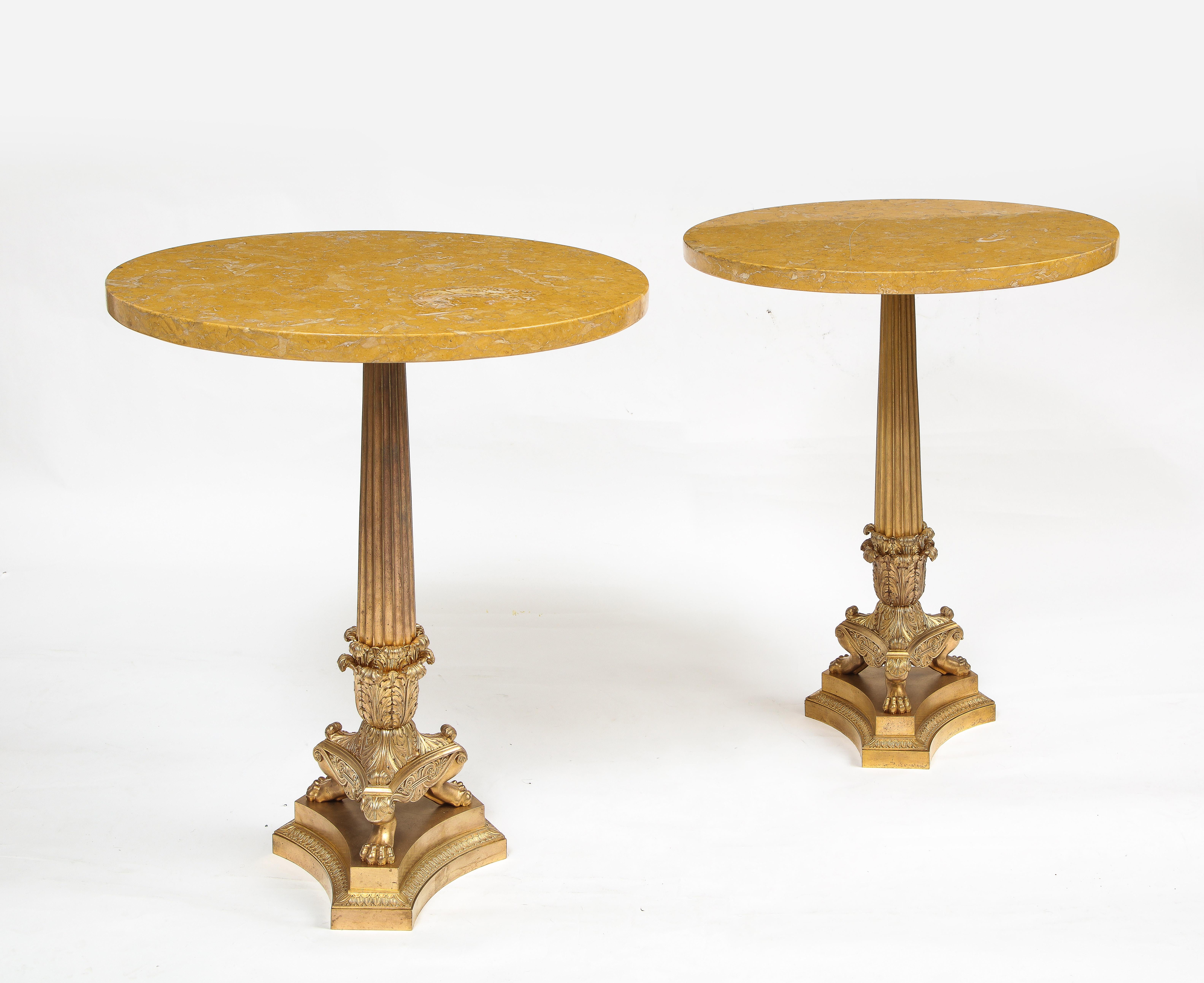 A Pair of 19th Century Empire Style Dore Bronze and Siena Marble Top Gueridons. The dore bronze bases are beautifully cast, hand-chased and hand-chiseled. The bottom of each table is supported on a triangular base with acanthus leaf borders and