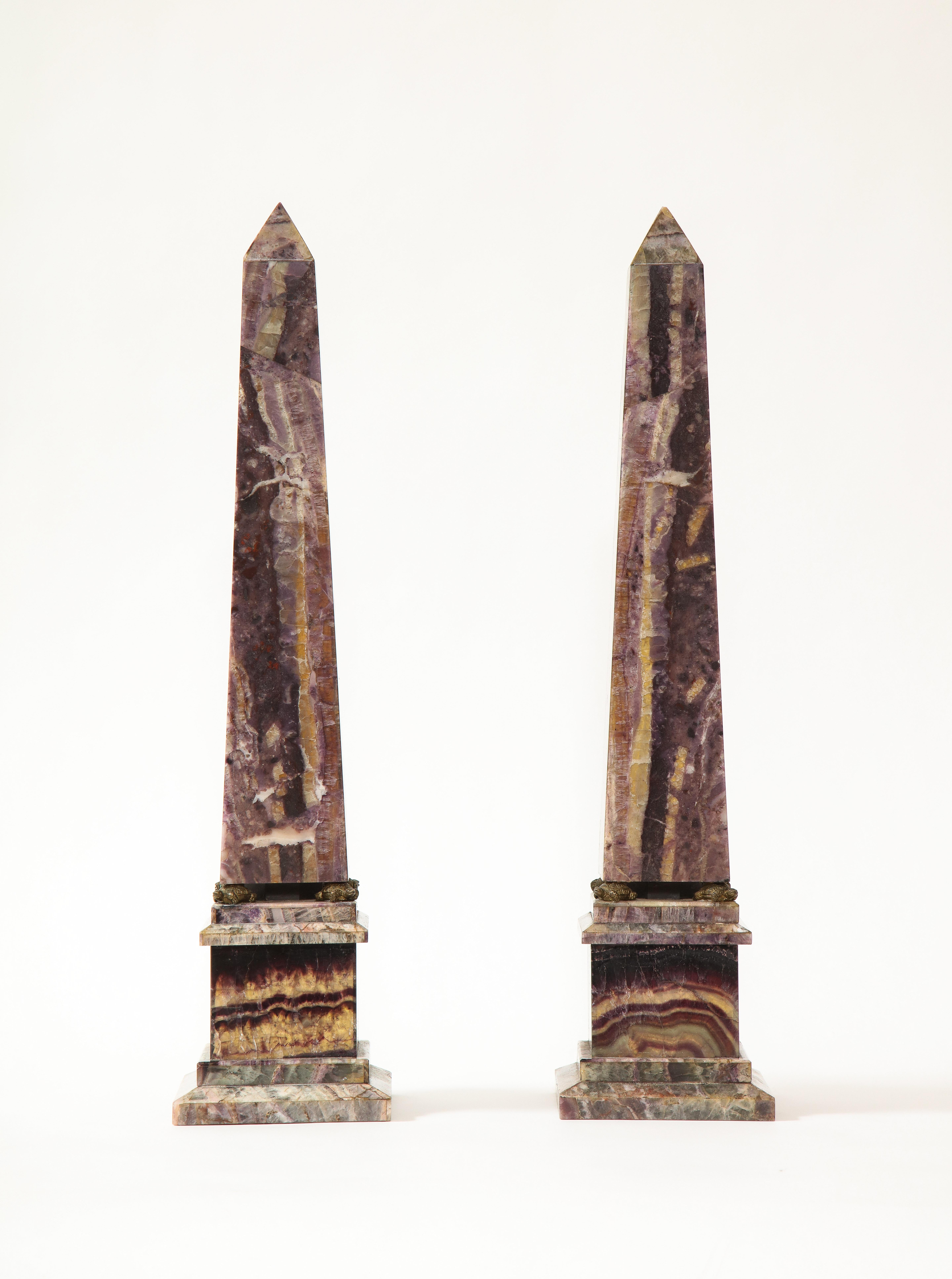 A fabulous and quite fine pair of 19th century Louis XVI style English turtle-form Ormolu Mounted Blue John (Fluorspar) Obelisks. Each obelisk is finely hand-carved with the finest quality English blue john and mounted on a square plinth. Between