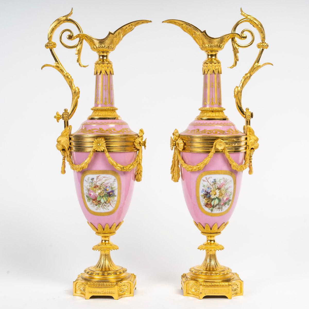A pair of 19th century ewers in Sèvres porcelain and gilt bronze.

A pair of 19th century ewers, Napoleon III period, in Sèvres porcelain and gilt bronze.
H: 36cm, W: 11cm, D: 13cm