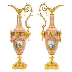 A Pair of 19th Century Ewers in Sèvres Porcelain and Gilt Bronze.