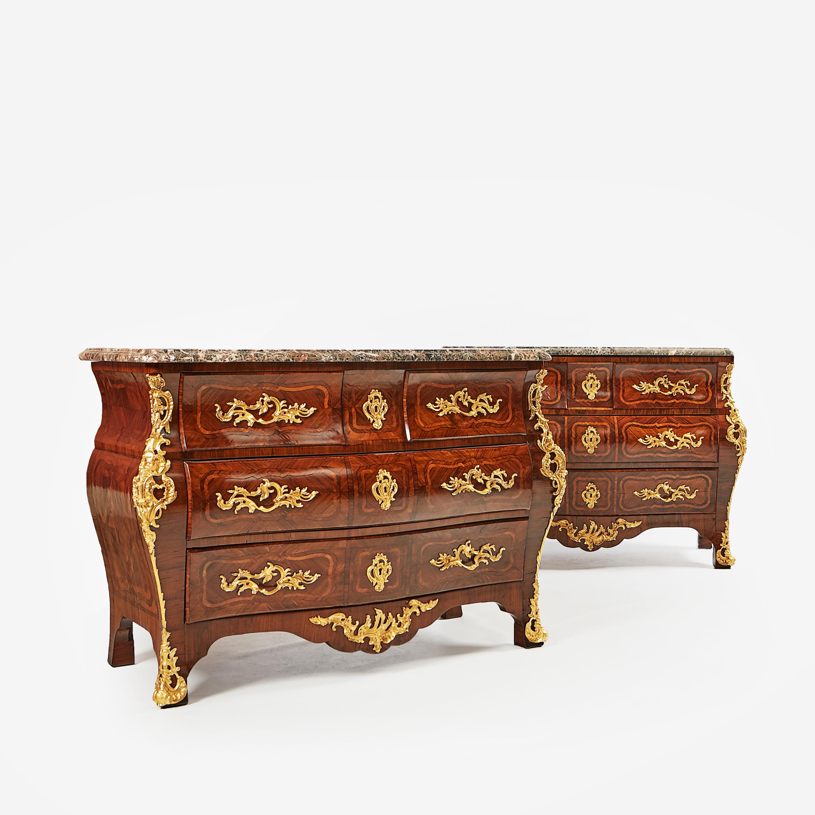 A fine pair of 19th century French commodes in the Louis XV style. Constructed in bookmatched kingwood veneers, inlaid with floral motifs, richly decorated with fine ormulo mounts, the original serpentine Breche d'Alep tops with a thumb moulded