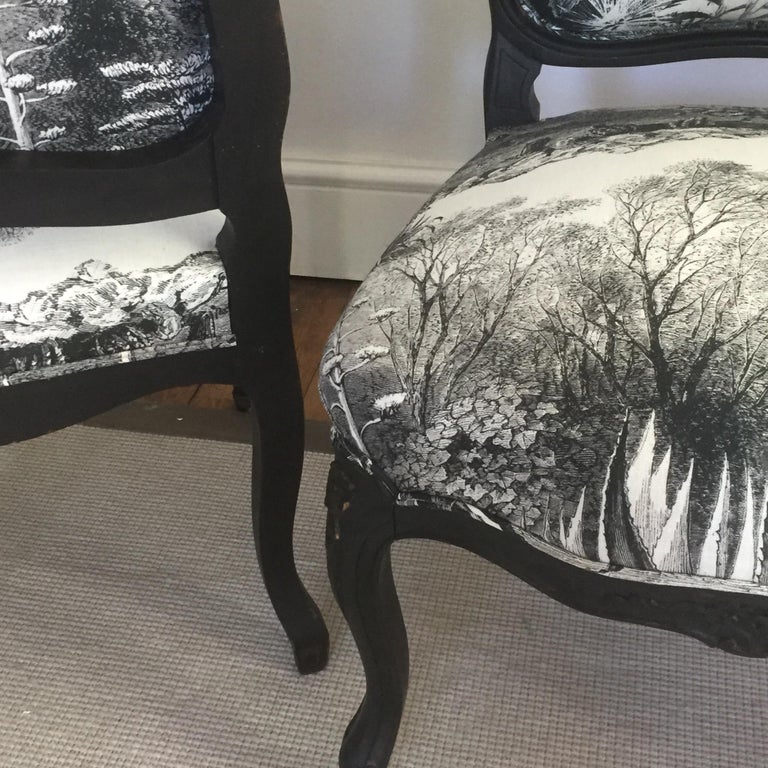 A pair of 19th century French ebonized side chairs upholstered in eye catching monochromatic linen with amazing engraving details. Perfect for occasional use.
These chairs have lovely deeply carved floral details, the legs terminate in the original