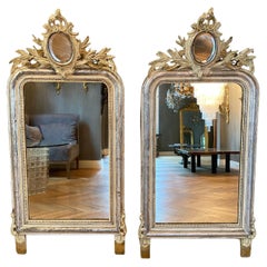 A pair of 19th century French gilt and carved mirrors