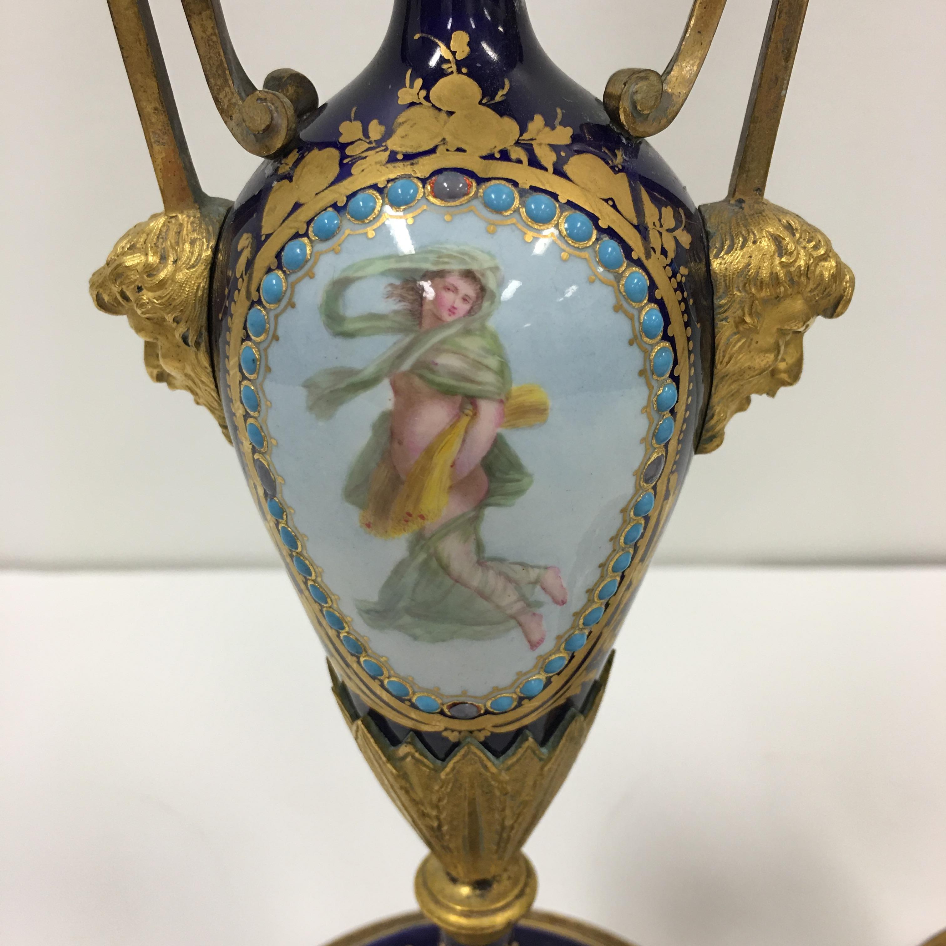 European A pair of 19th. century French Sevres porcelain and ormolu candlesticks.