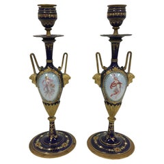 A pair of 19th. century French Sevres porcelain and ormolu candlesticks.