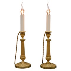 A pair of 19th century gilt bronze Empire candlesticks