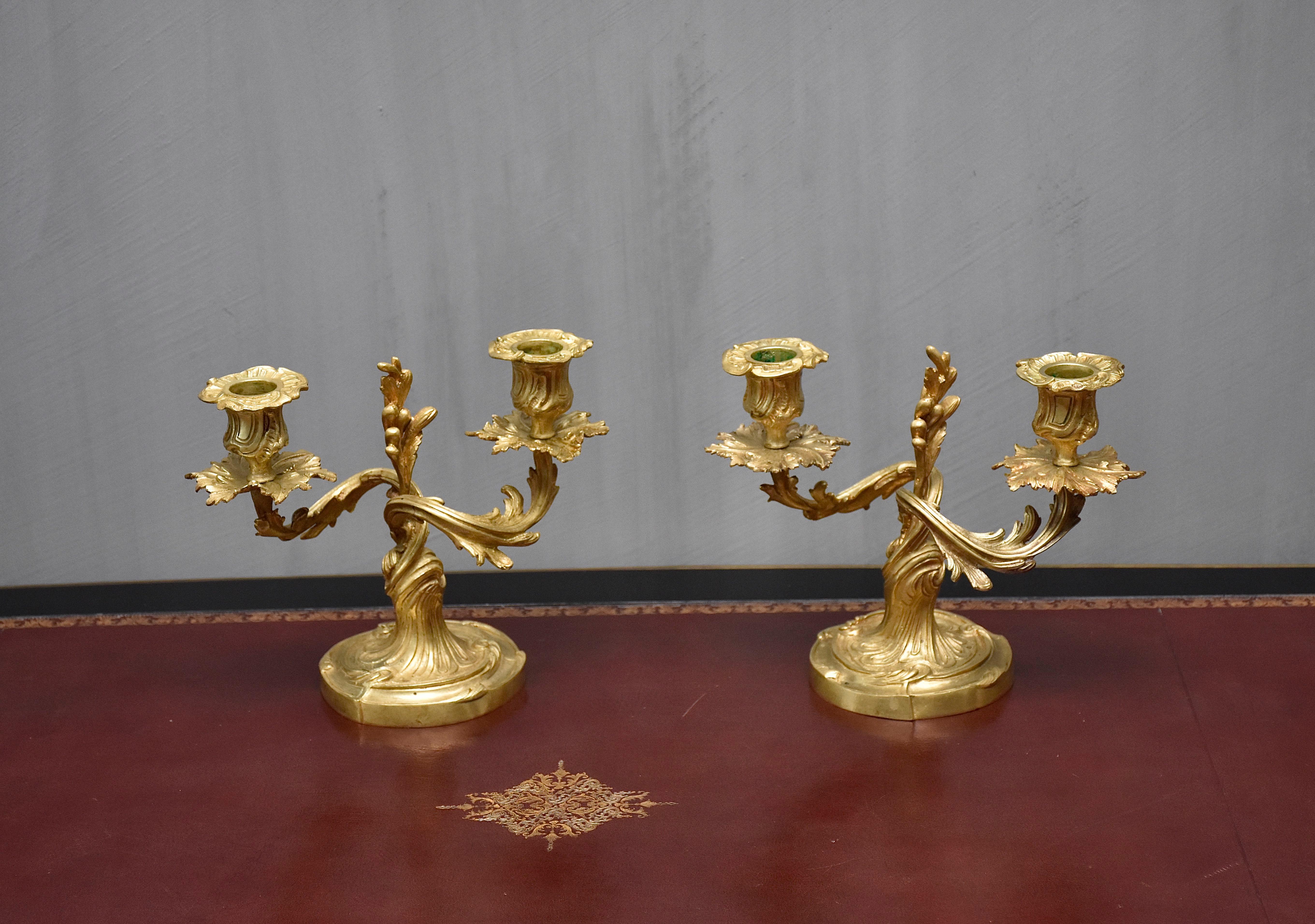 Rococo A pair of 19th century gilt bronze French candelabra For Sale