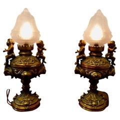Antique Pair of 19th Century Gilt Lamps in the Form of Cherubs or Putti