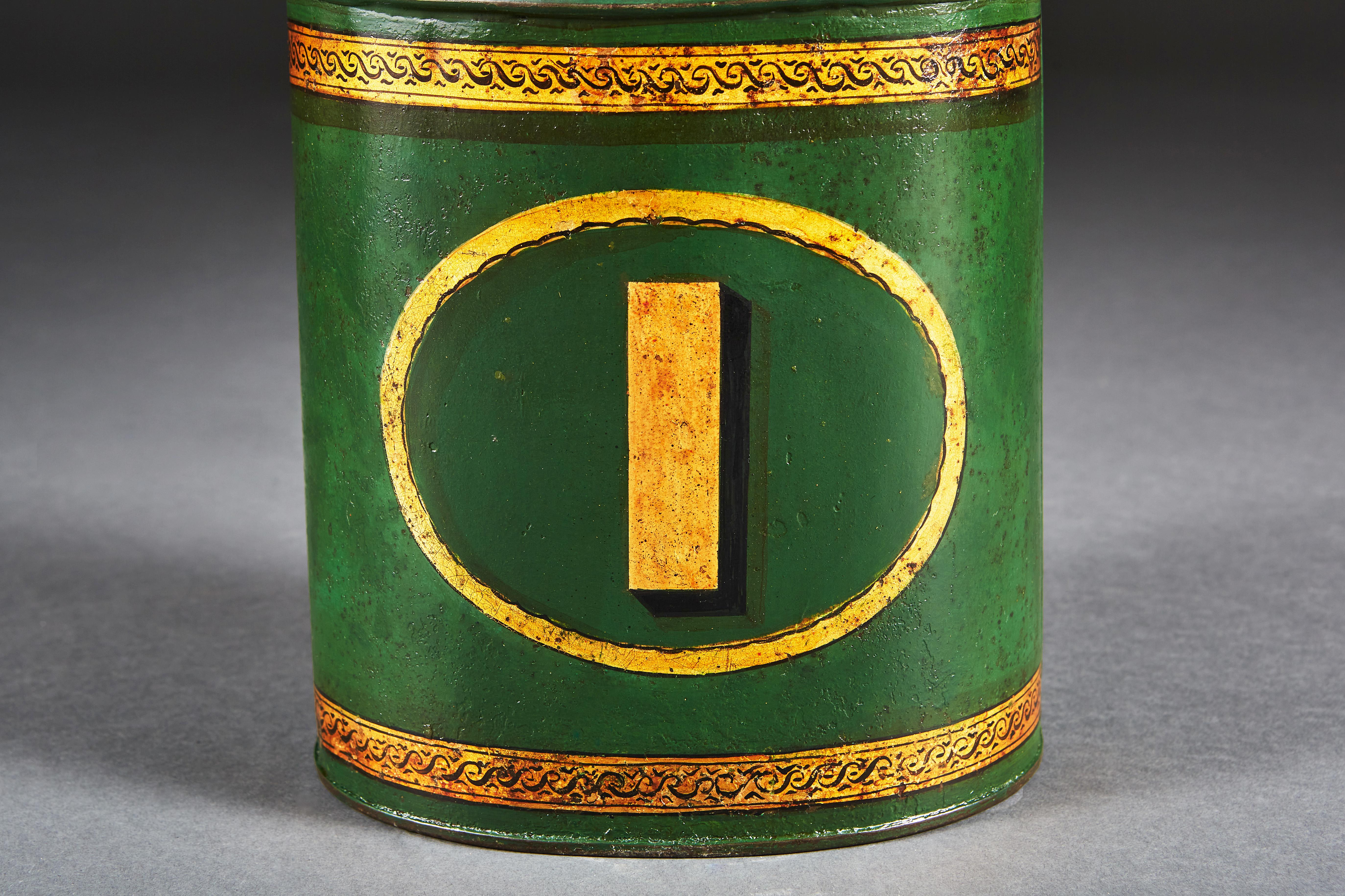 A pair of late 19th century green toleware tea tins, decorated with numbers 1 and 2 to the fronts, now converted as lamps.

Please note: lampshades not included.

Currently wired for the UK.