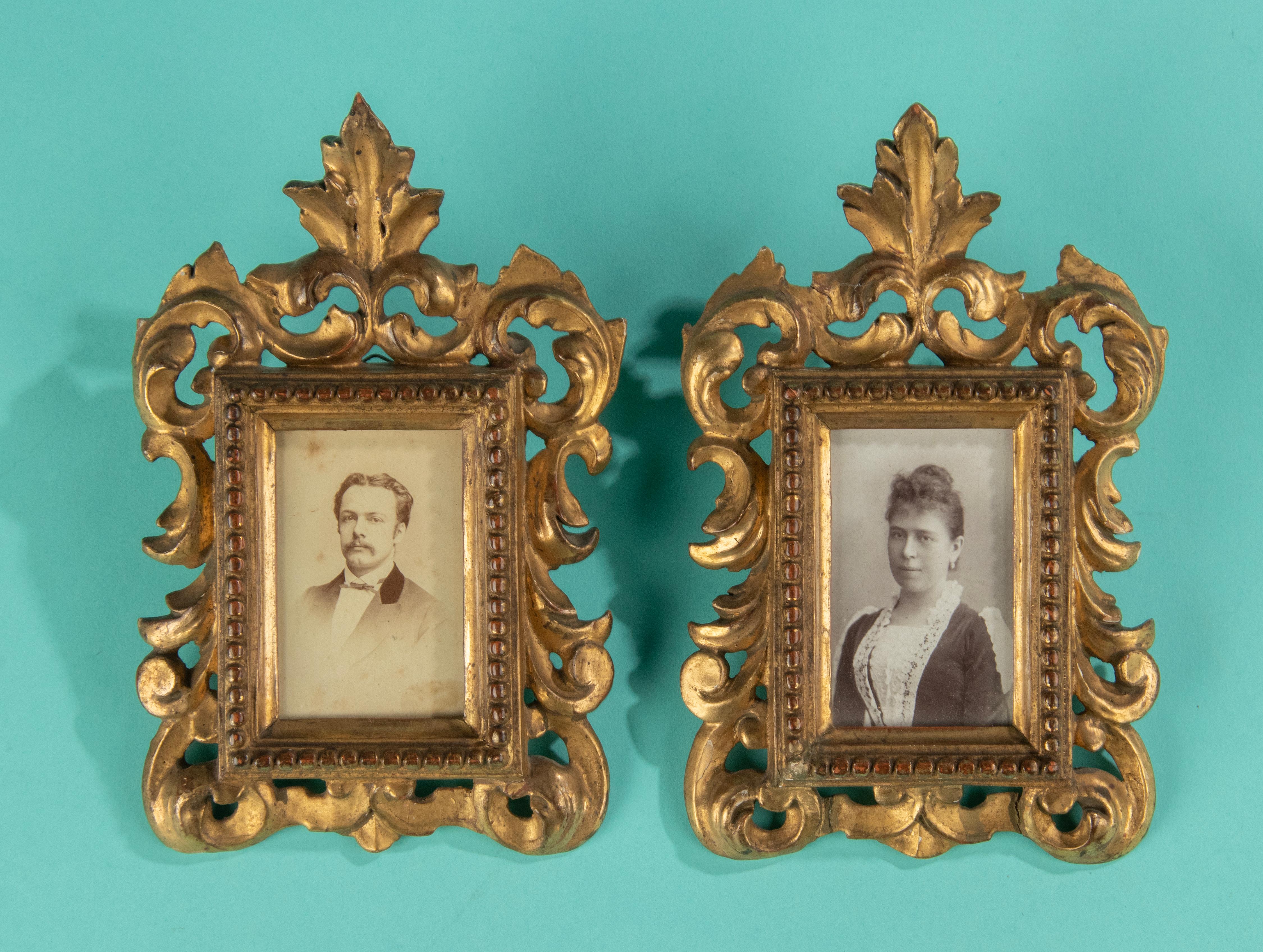 A lovely pair of antique gilded picture frames. The frames are made of wood, hand carved with beautiful curls. There is a thin layer of gesso on the wood, then they are gilded. This is a nice piece of craftsmanship. Dimensions of the pictures: 8 x 5