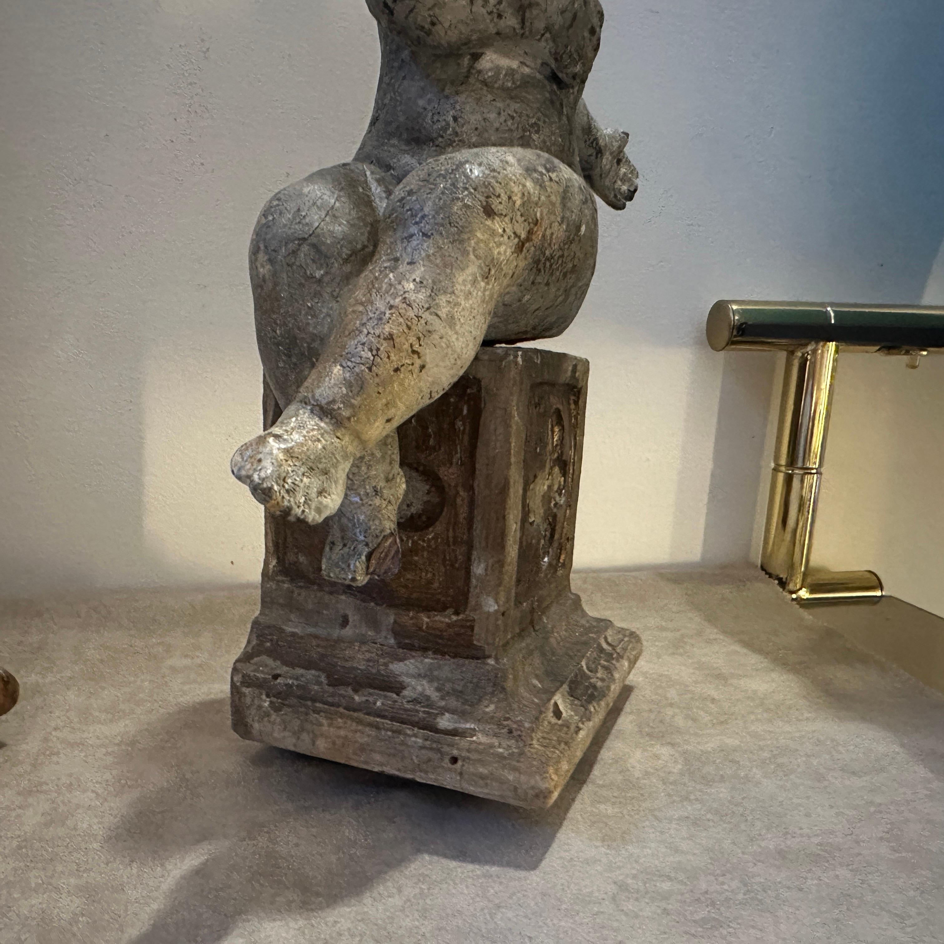 A pair of  19th Century Italian Wooden Putti Mounted on 18th Century Bases 7