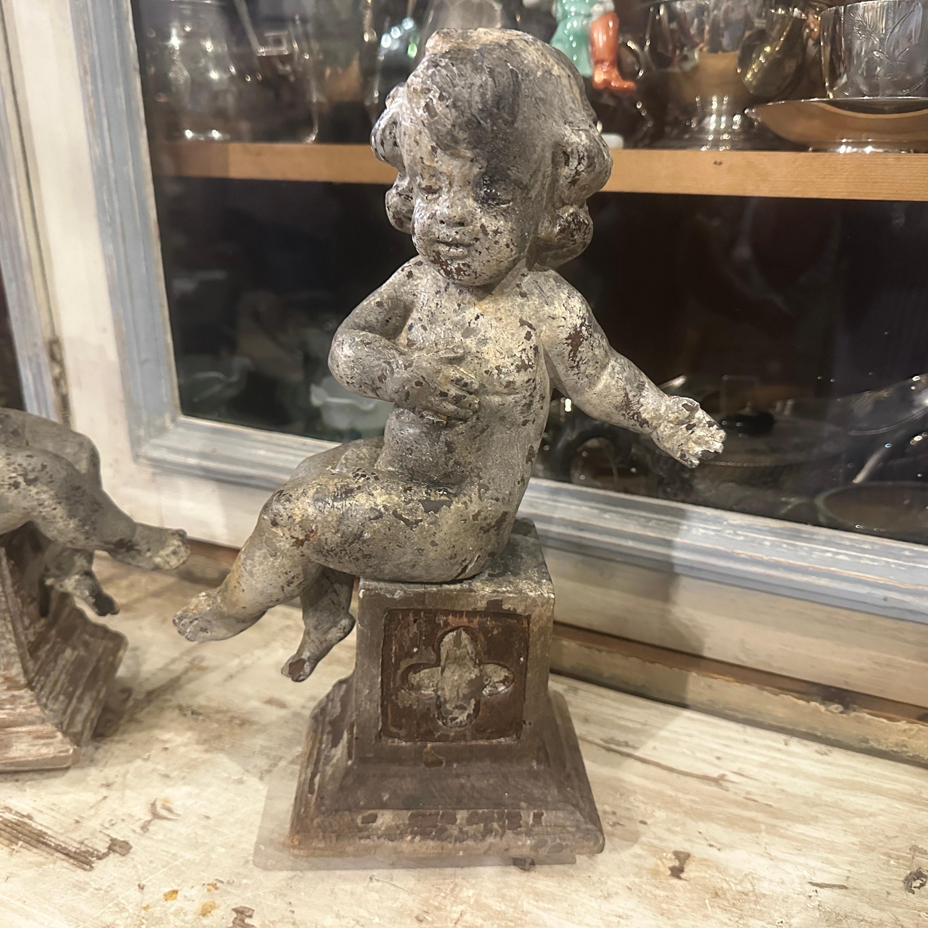 A pair of  19th Century Italian Wooden Putti Mounted on 18th Century Bases 9