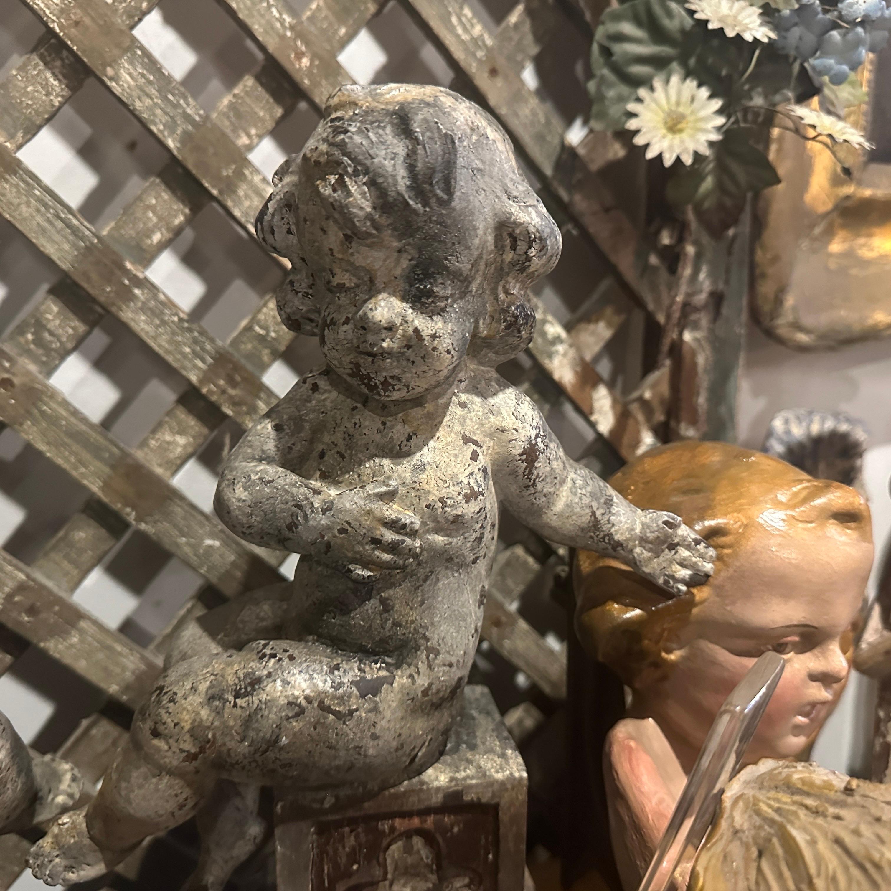 A pair of  19th Century Italian Wooden Putti Mounted on 18th Century Bases 12