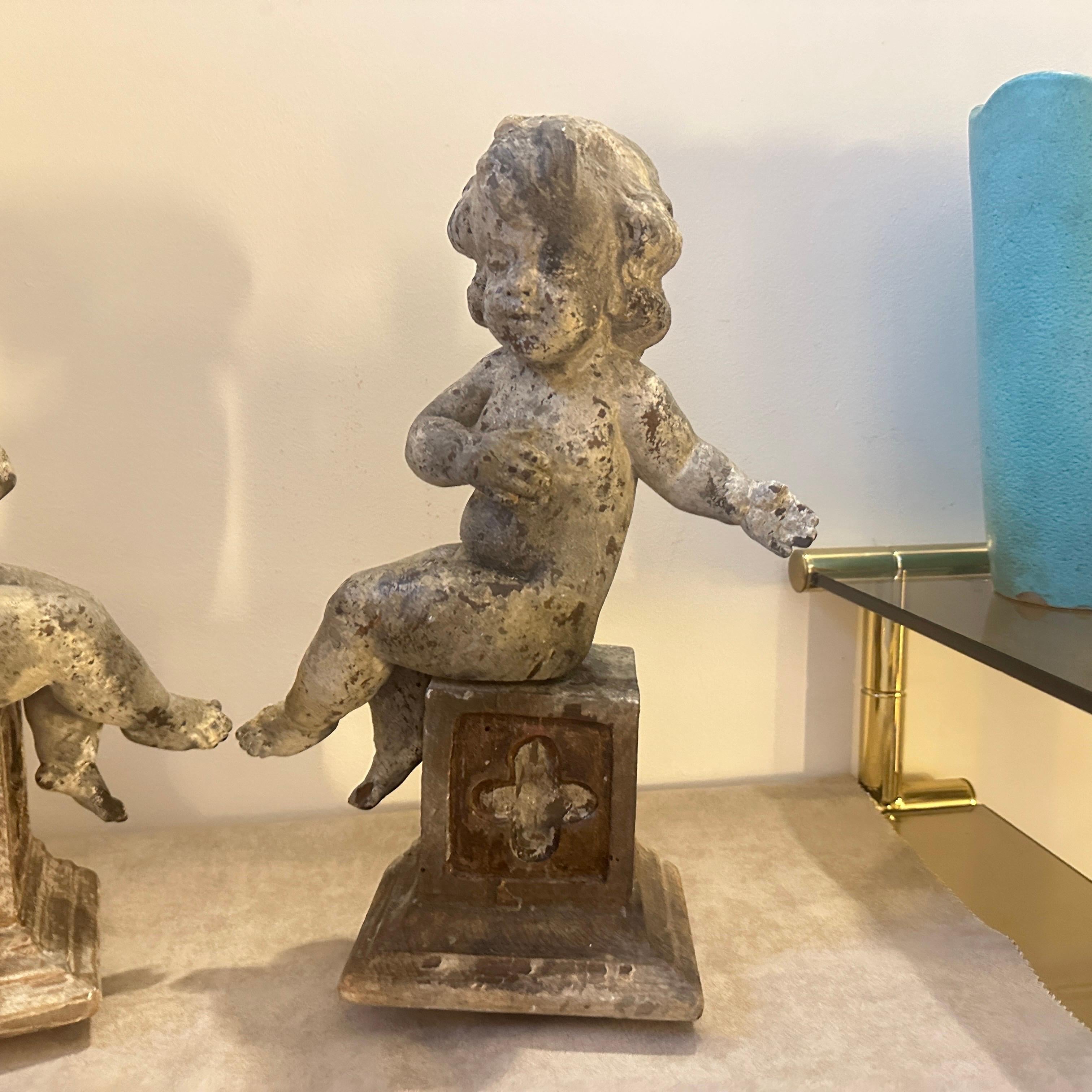 A pair of  19th Century Italian Wooden Putti Mounted on 18th Century Bases In Fair Condition In Catania, Sicilia