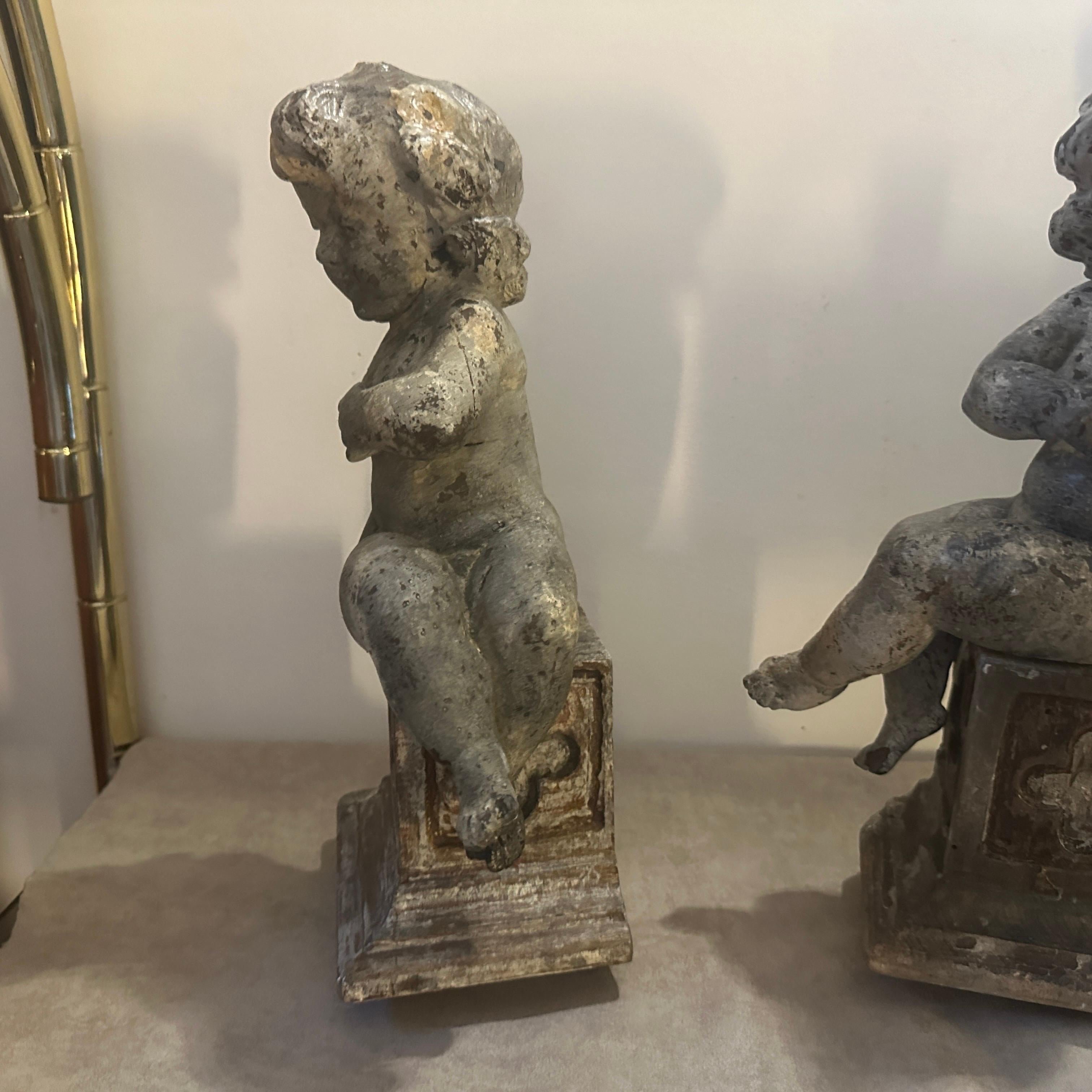 Fruitwood A pair of  19th Century Italian Wooden Putti Mounted on 18th Century Bases