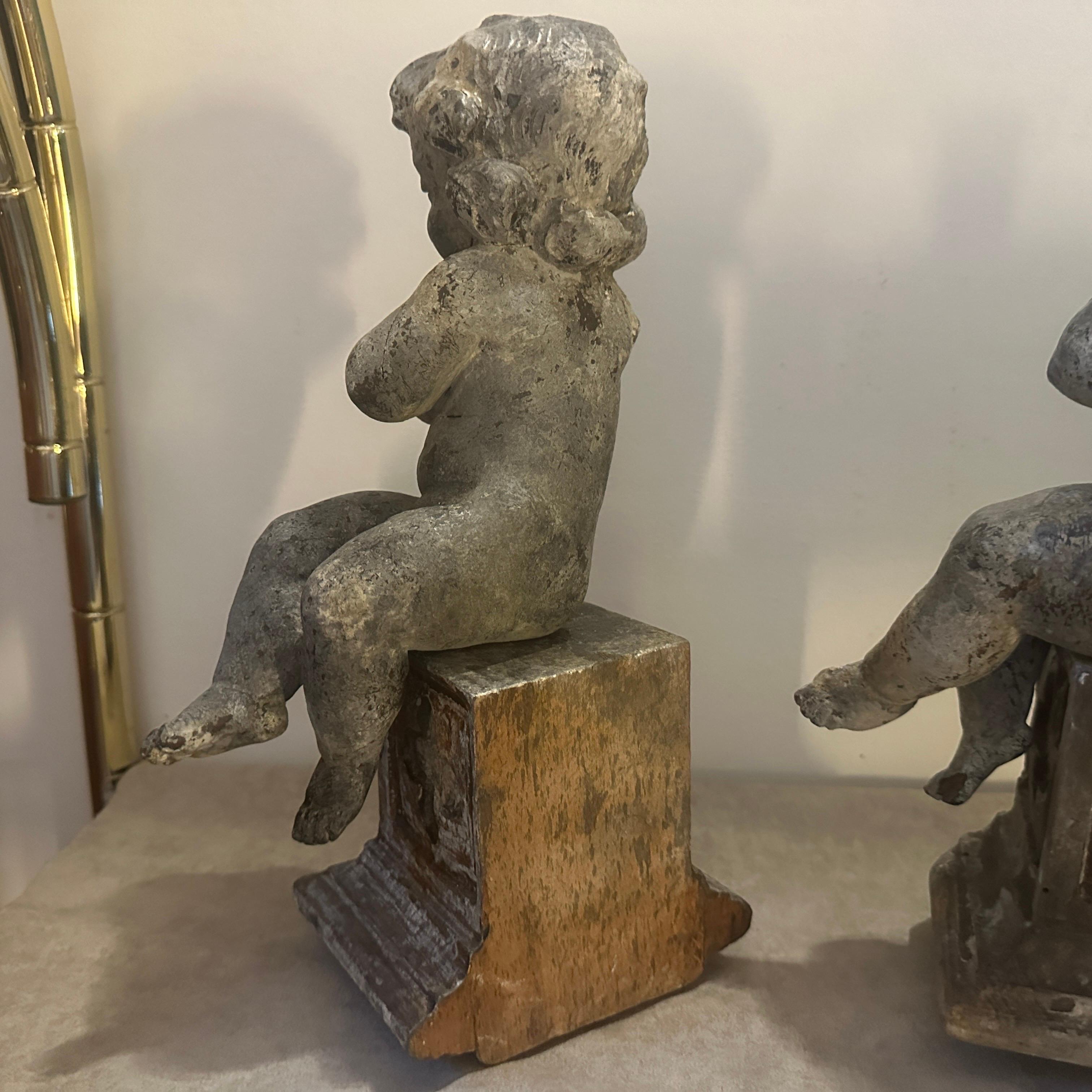 A pair of  19th Century Italian Wooden Putti Mounted on 18th Century Bases 3