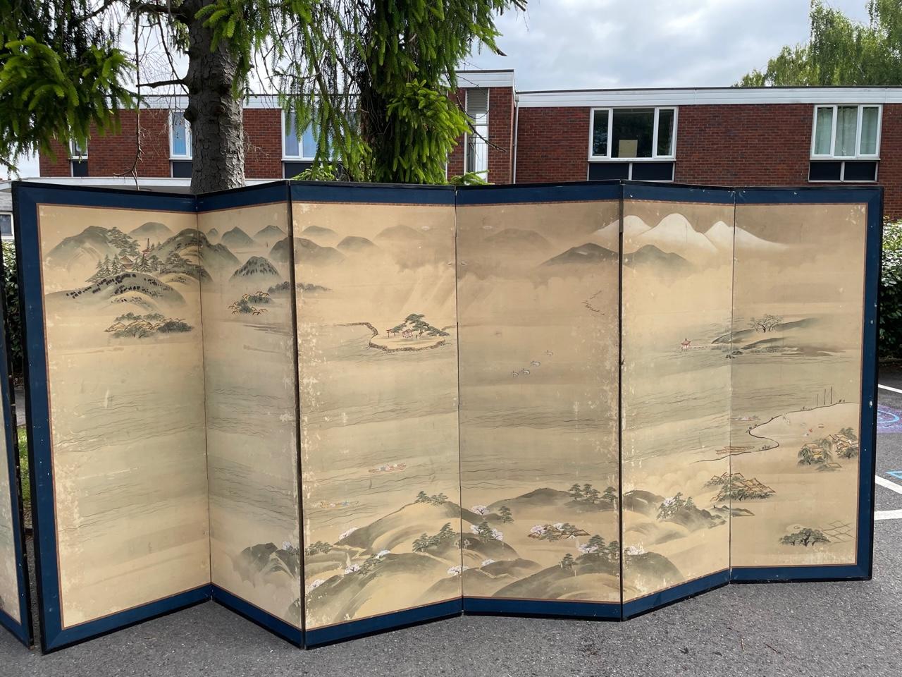 A pair of large 19th century Japanses Screens of Japanese scenery.

The screens also come with a wooden crate which would have been built for them at a later date in order to move them around safely.

The screens do come with some ware and very