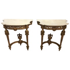 A pair of 19th Century Louis XVI Style carved gilt-wood and gesso console tables