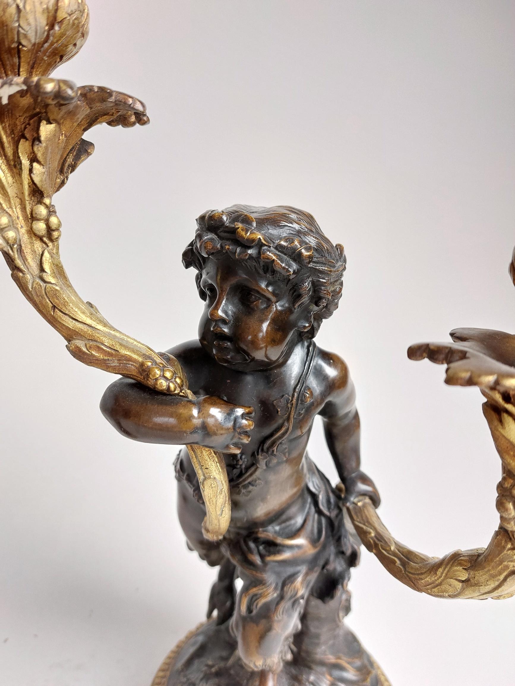 French Pair of 19th Century Ormolu Candlestick Holders Held by Bronze Fawns/Cherubs For Sale