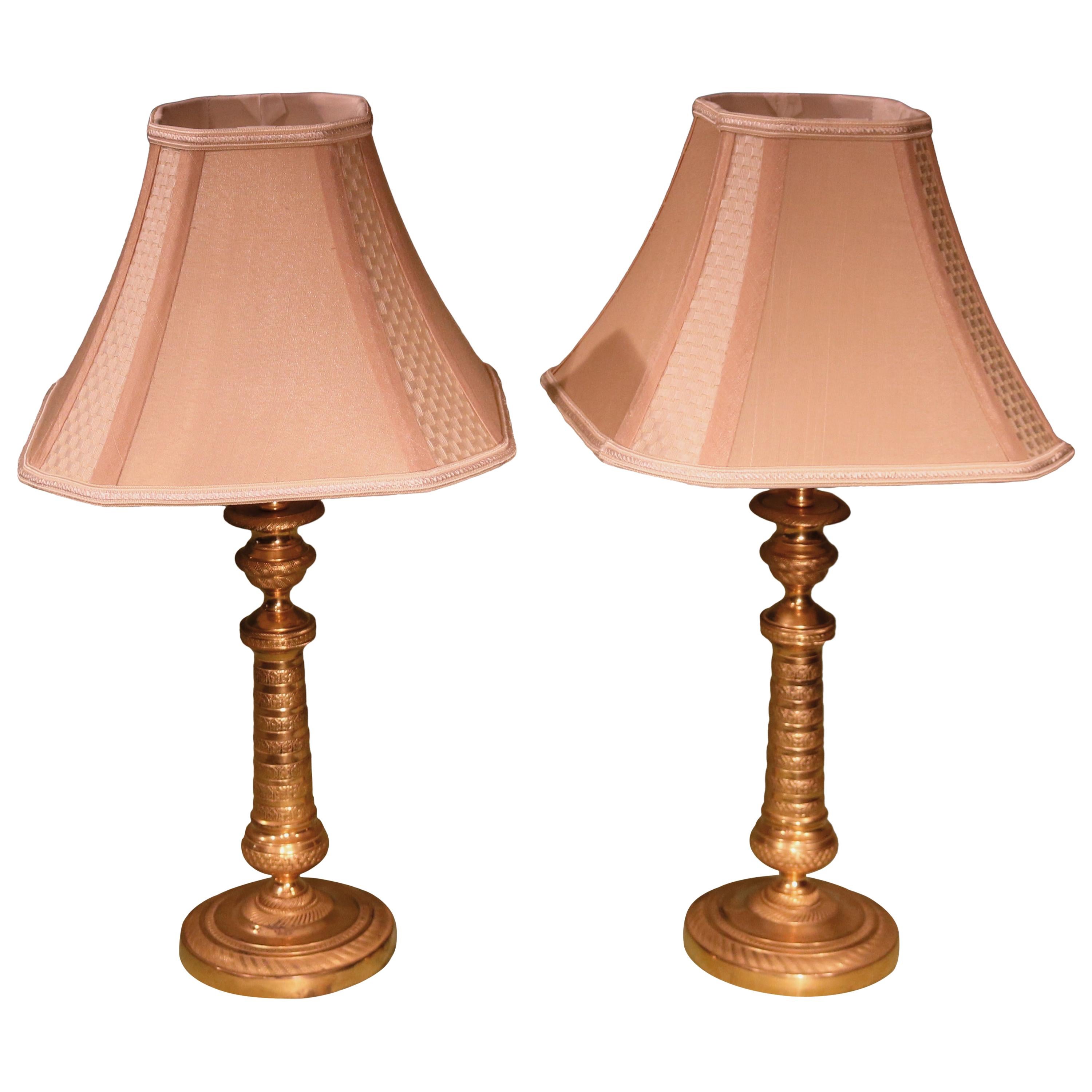 Paire de lampes à bougeoirs en bronze doré du XIXe siècle