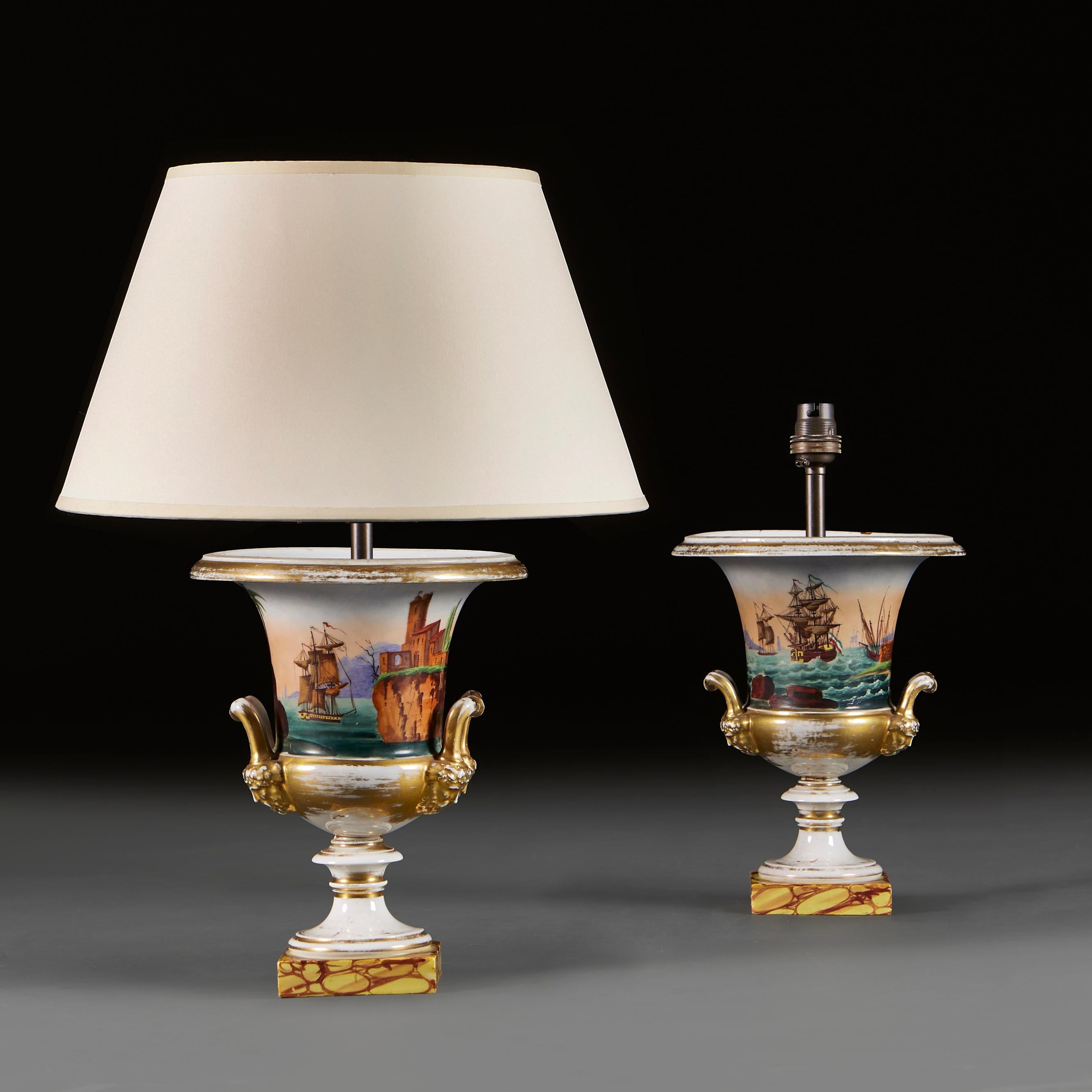 France, circa 1860

A pair of mid ninetieth century urns decorated with maritime scenes, painted with ships and palm trees in a fantasy landscape, with stylised handles and bearded masks, all supported on yellow variegated bases. 

Height of vases  
