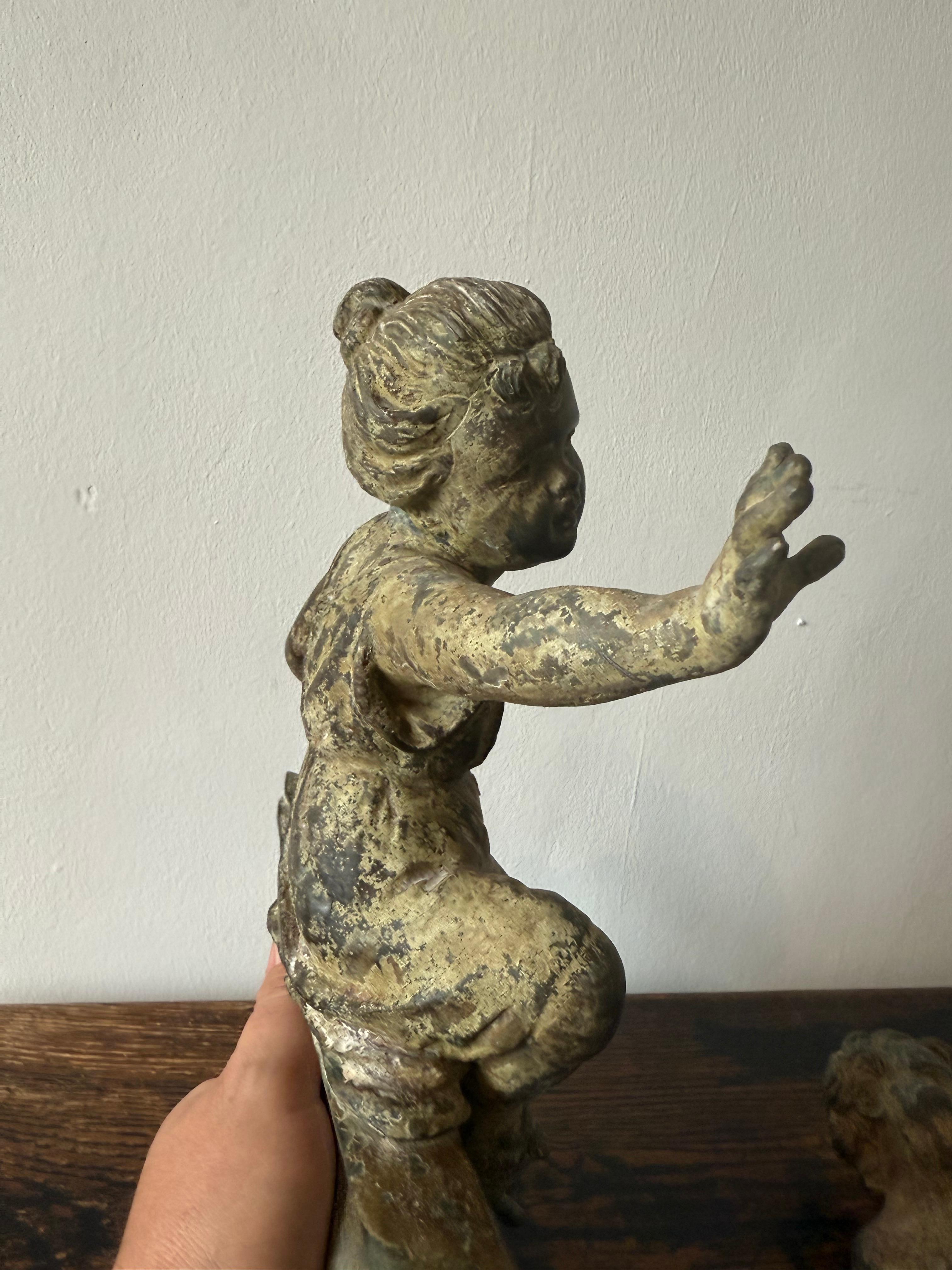 Paire de putti français patinés du 19ème siècle en vente 1