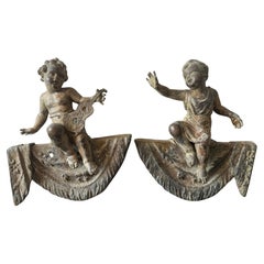 Paire de putti français patinés du 19ème siècle