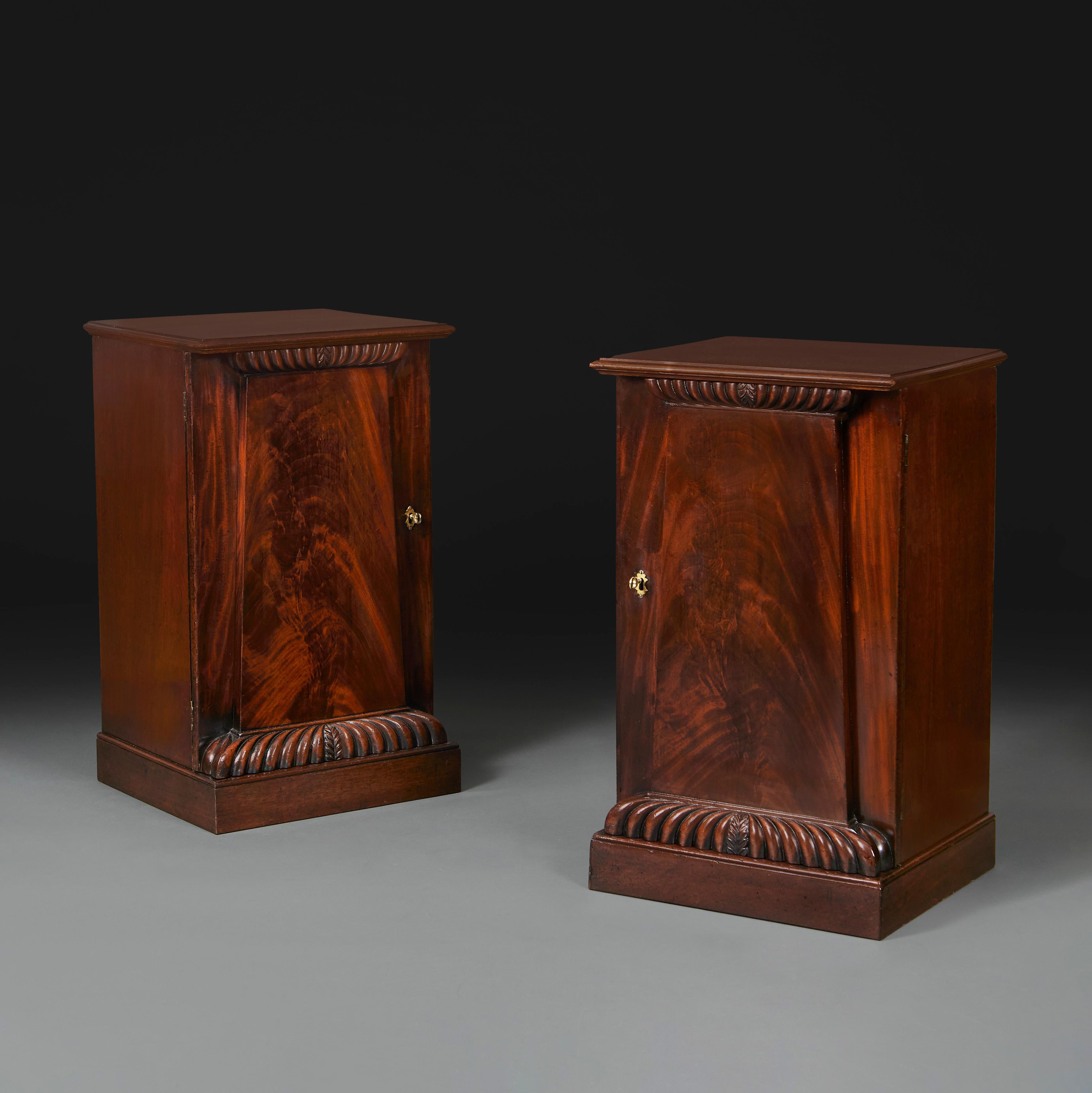 England, circa 1880

A pair of late nineteenth century mahogany bedside cabinets of pedestal form, opening with one door to the fronts, with carved gadrooning to top and base. 

Height    77.00cm

Width     45.00cm

Depth     39.50cm