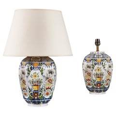 A pair of 19th century polychrome delft vases as lamps 